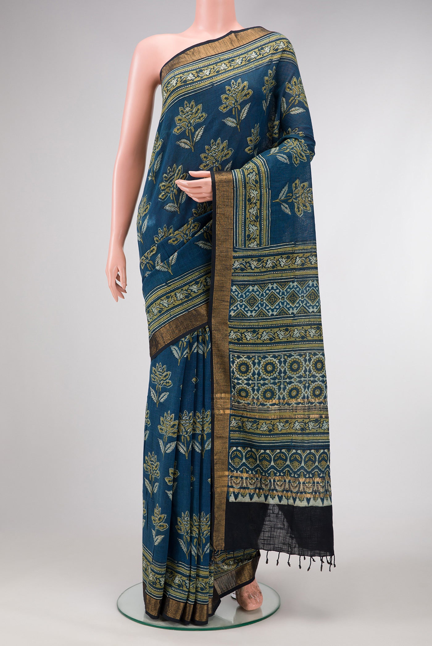 Navy Blue Dual Tone Cotton Saree with Ajrakh Print on the body and Zari Border.  displayed on a mannequin