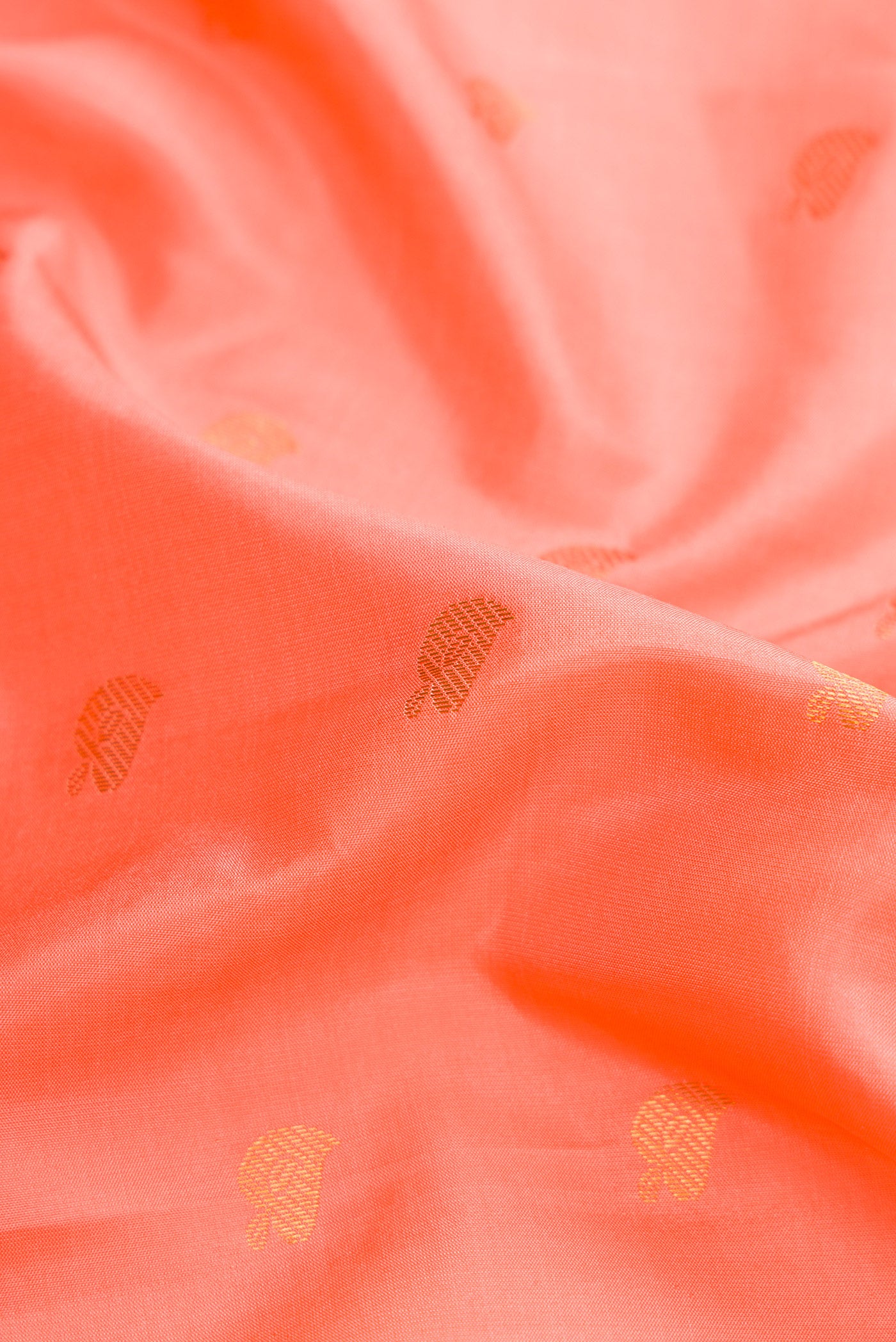Close up of Peach Dual Tone Gadwal Silk Saree with Zari Butta on the body and Zari Border.  displaying folds