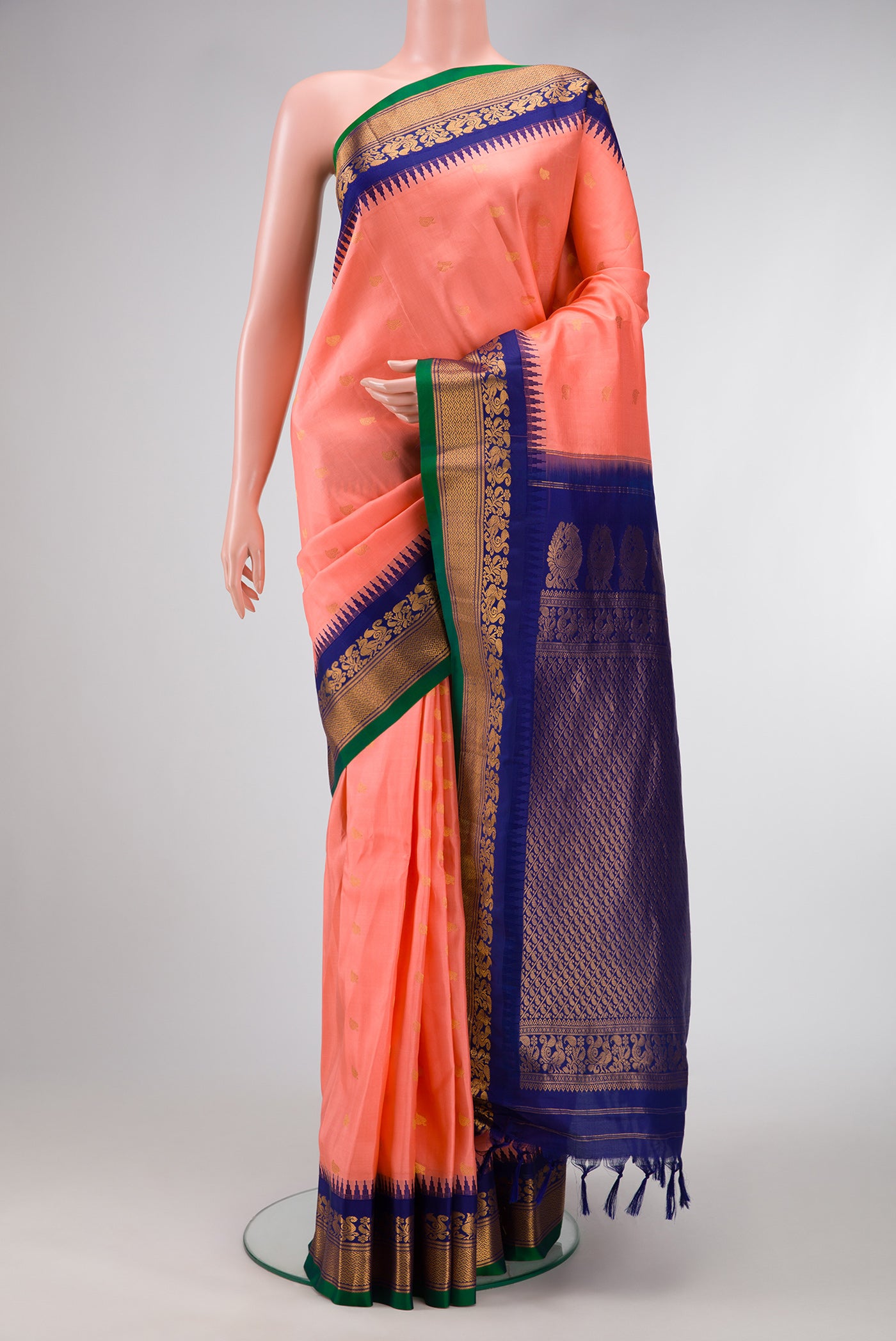 Peach Dual Tone Gadwal Silk Saree with Zari Butta on the body and Zari Border.  displayed on a mannequin