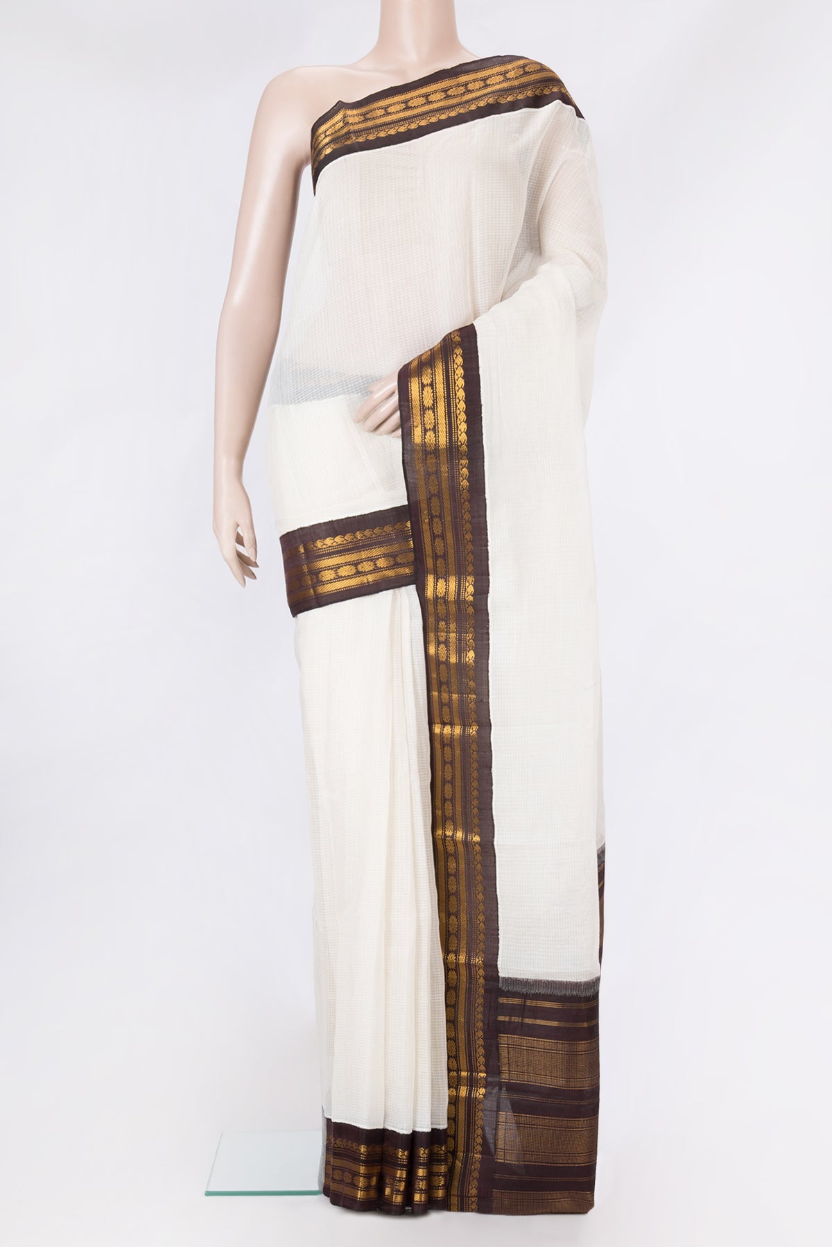White Gadwal cotton Saree with Checked design on the body and Zari Border.  displayed on a mannequin