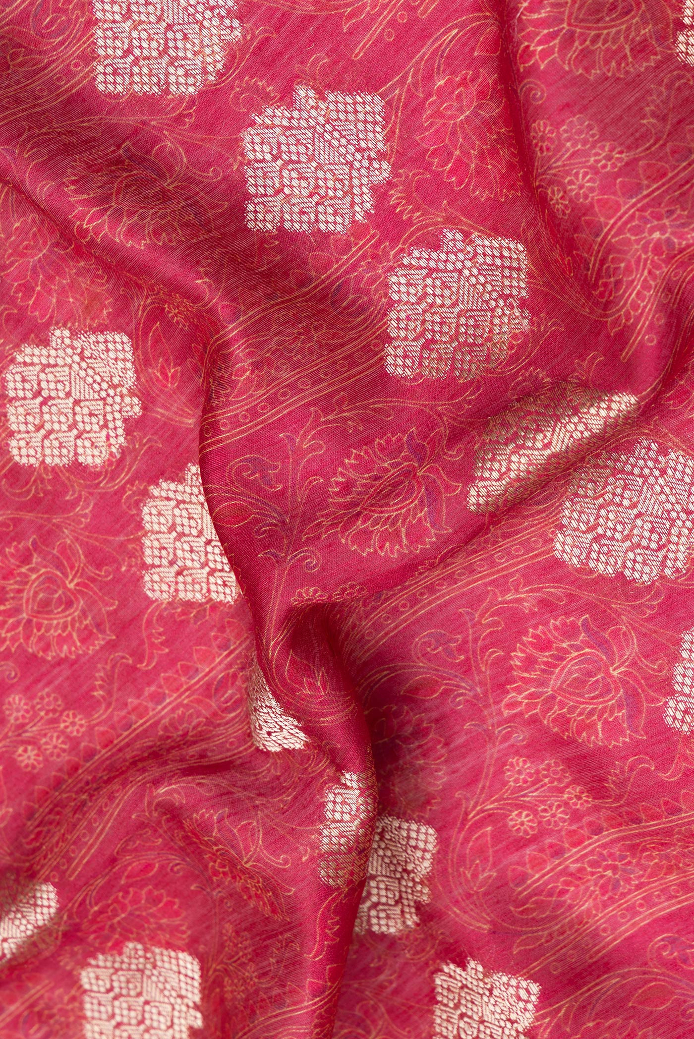Close up of Pink Tussar Silk Saree with Zari Butta on the body and Embroidery Border.  displaying folds