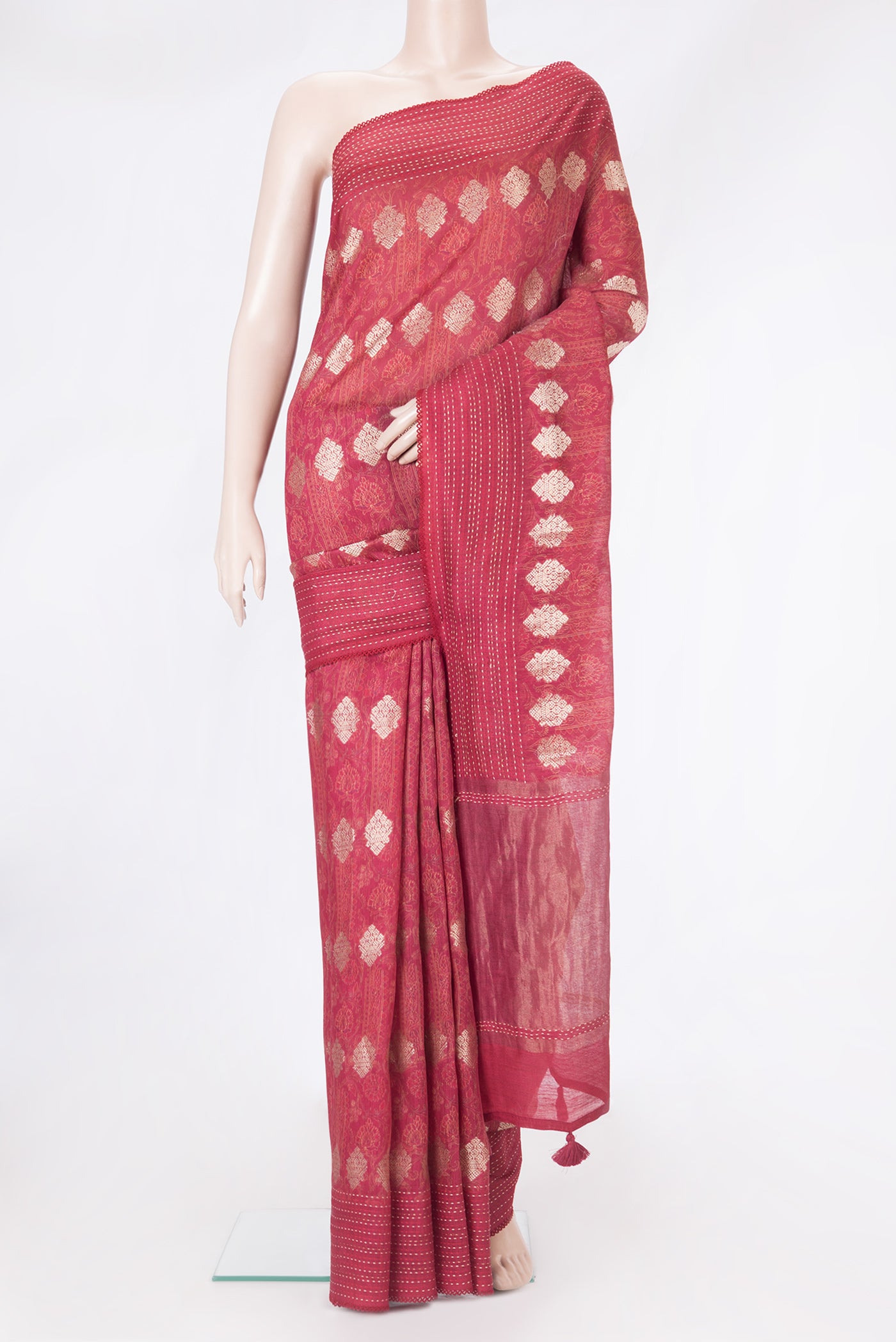 Pink Tussar Silk Saree with Zari Butta on the body and Embroidery Border.  displayed on a mannequin