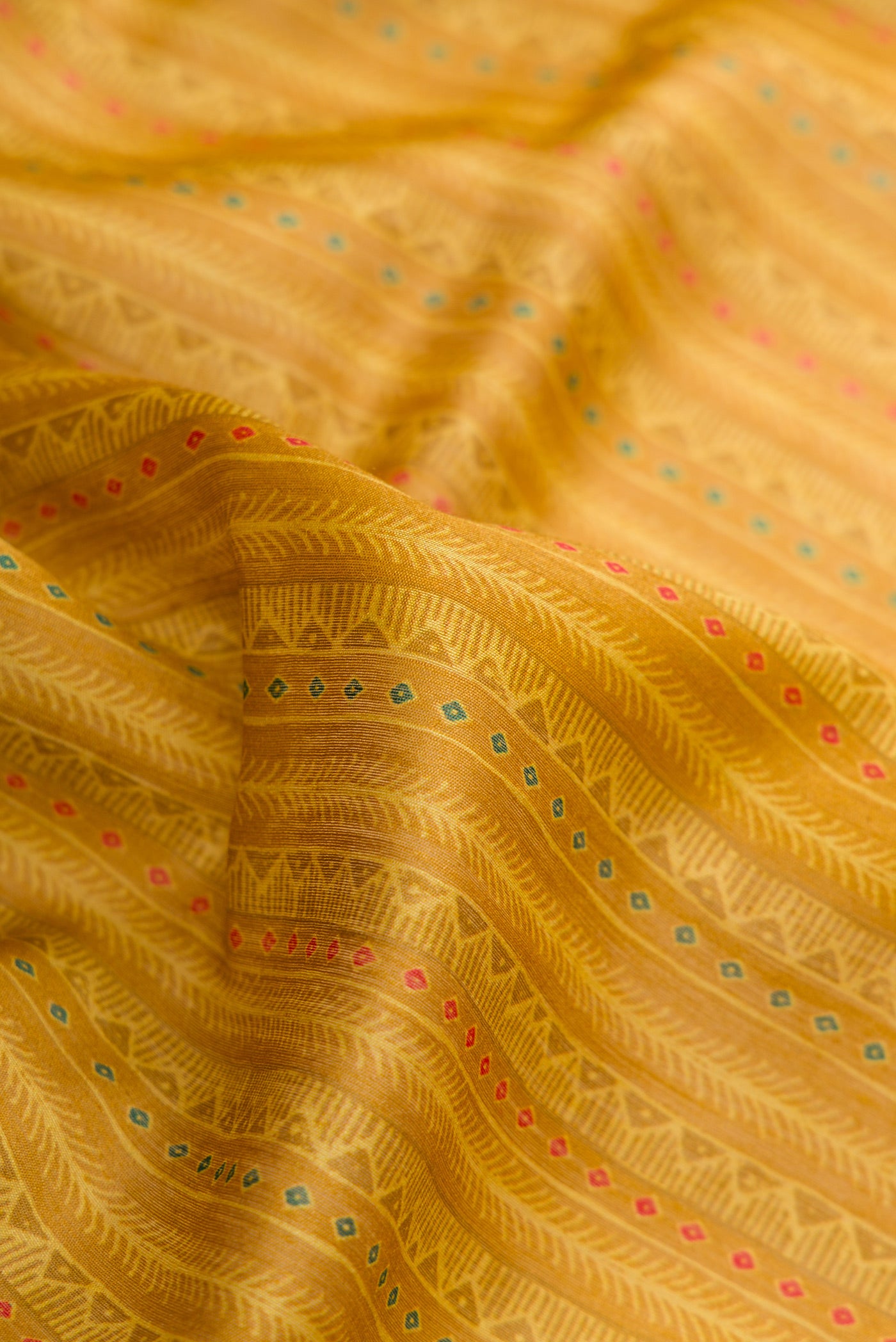 Close up of Mustard Dual Tone Tussar Silk Saree with Stripes on the body and Zari Border.  displaying folds