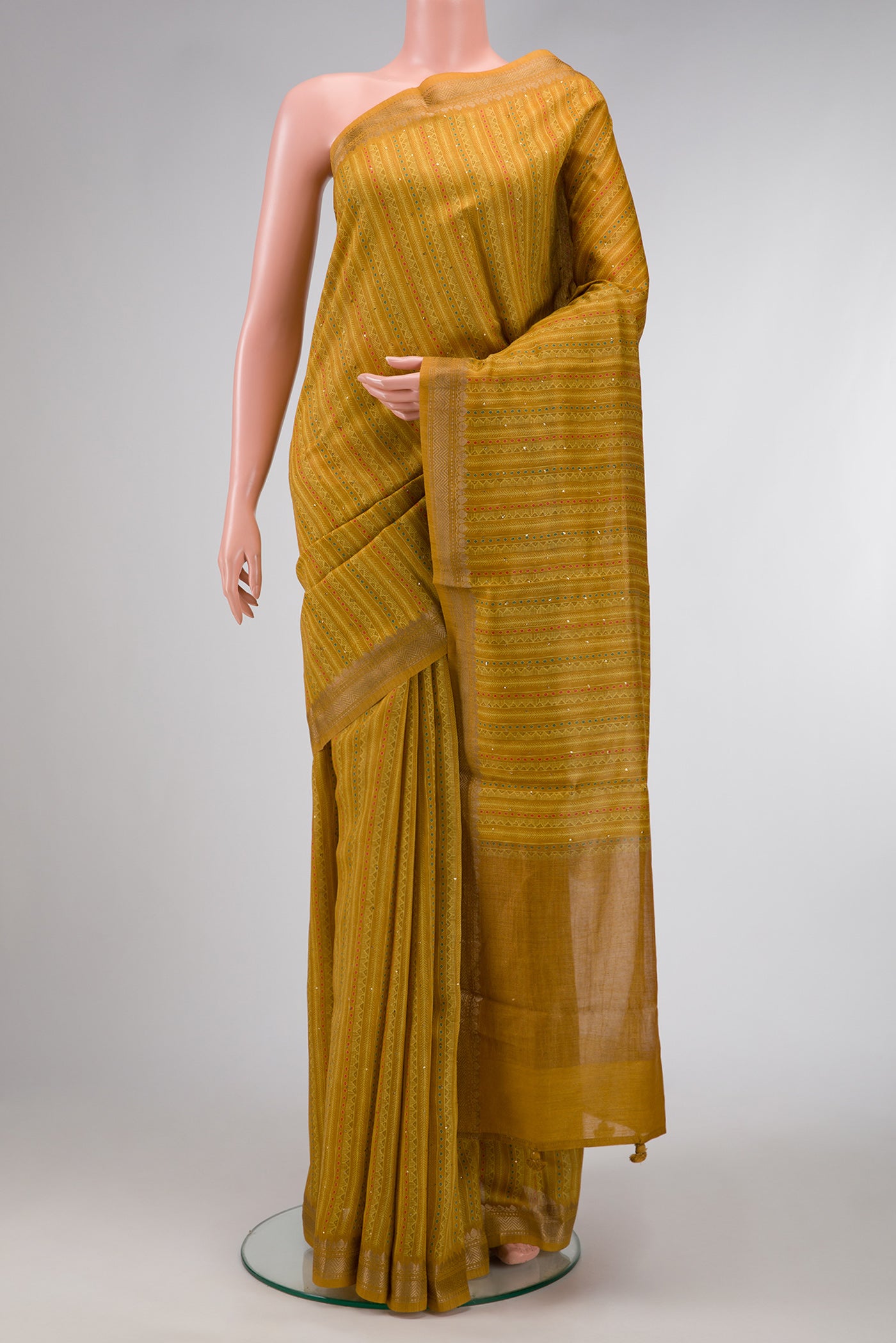 Mustard Dual Tone Tussar Silk Saree with Stripes on the body and Zari Border.  displayed on a mannequin