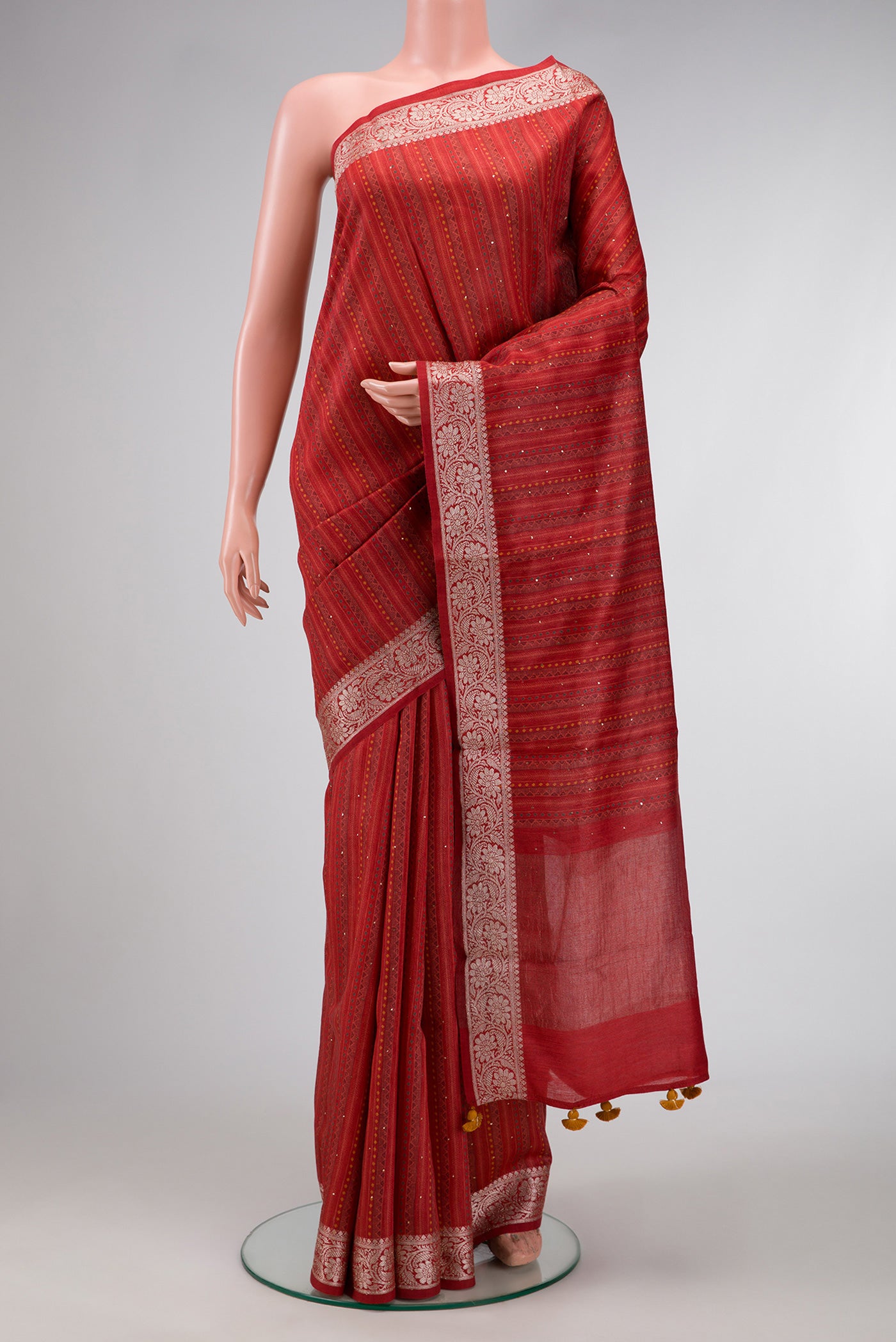 Dark Pink Dual Tone Tussar Silk Saree with Printed design on the body and Thread Border.  displayed on a mannequin