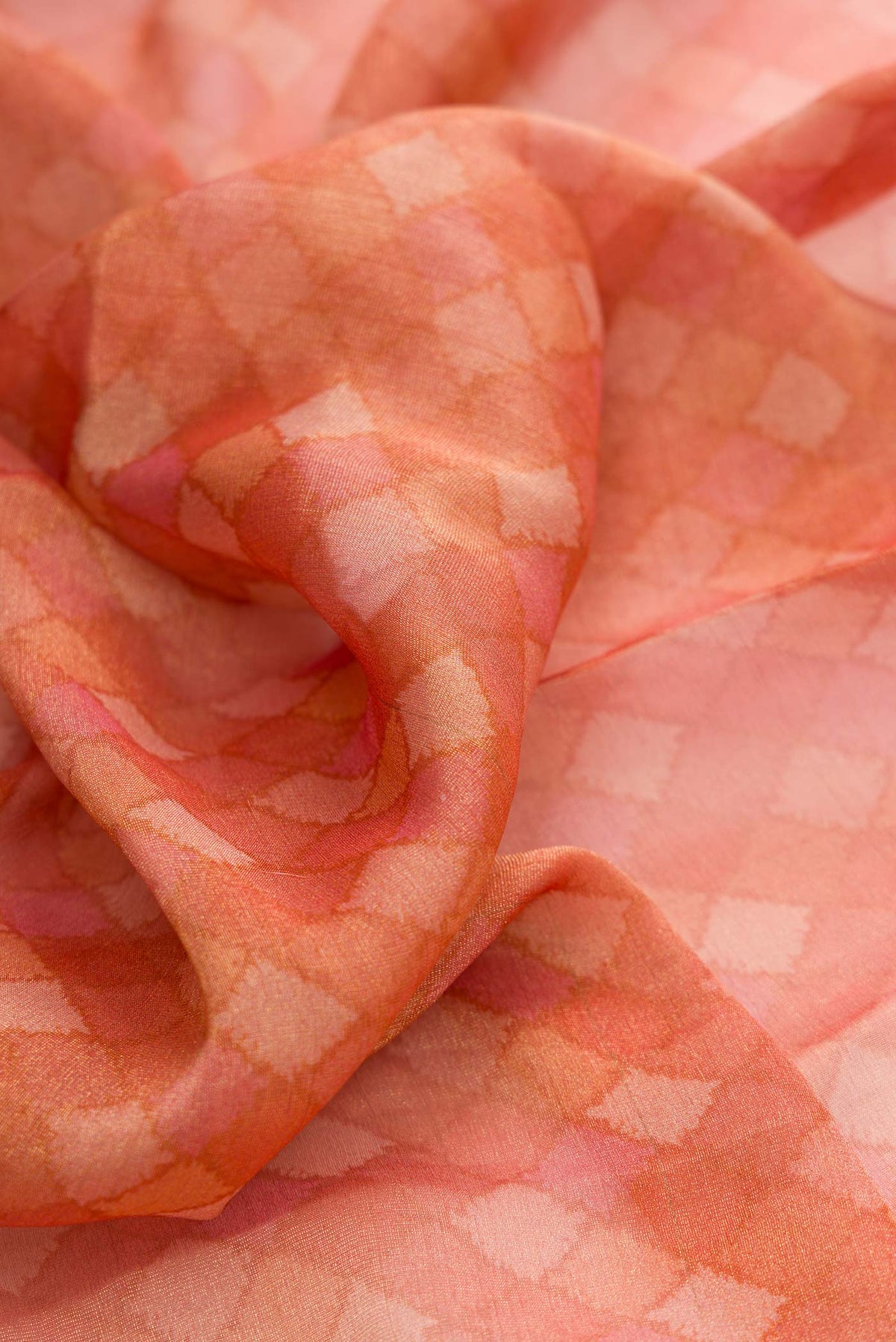 Close up of Peach Dual Tone Mysore Georgette Saree with Zari Brocade on the body and Zari Border displaying folds