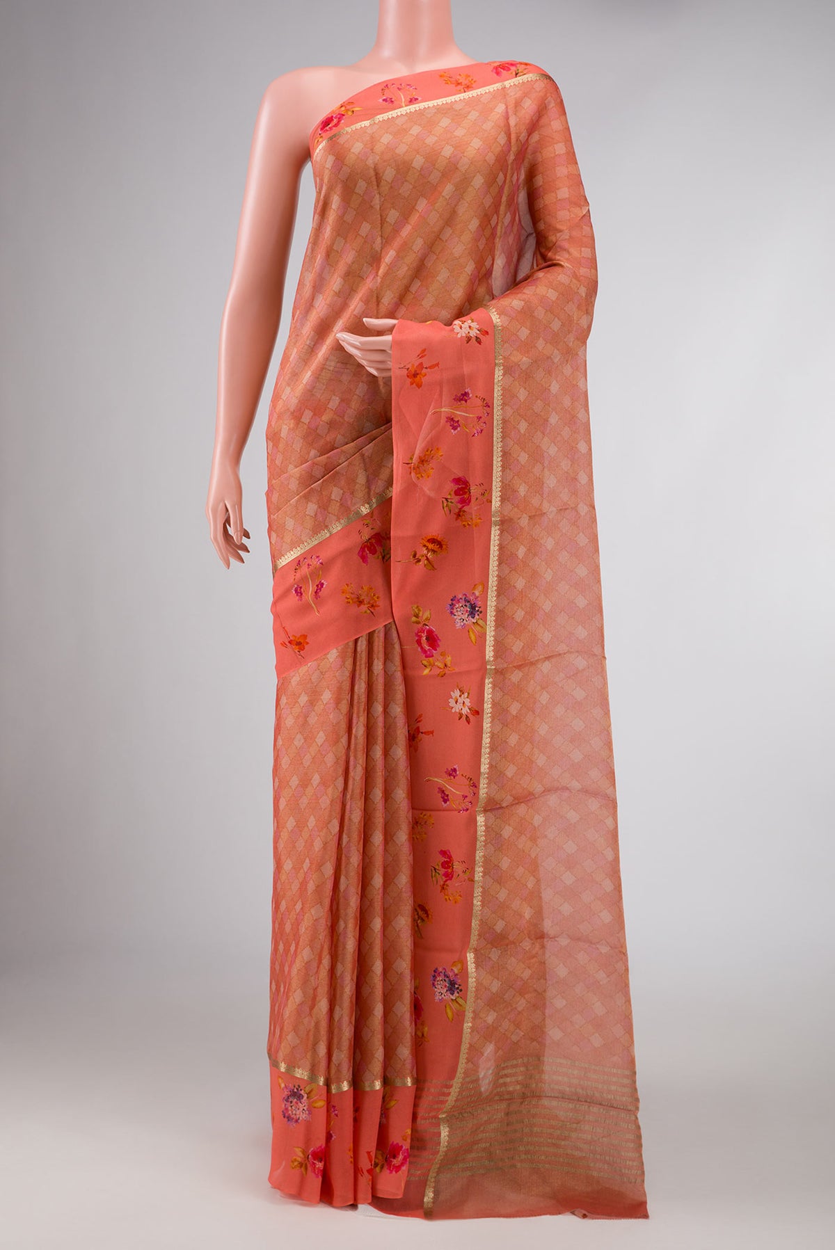 Peach Dual Tone Mysore Georgette Saree with Zari Brocade on the body and Zari Border displayed on a mannequin