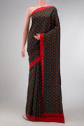 Black Dual Tone Printed Silk Saree with Printed design on the body and Plain Border.  displayed on a mannequin