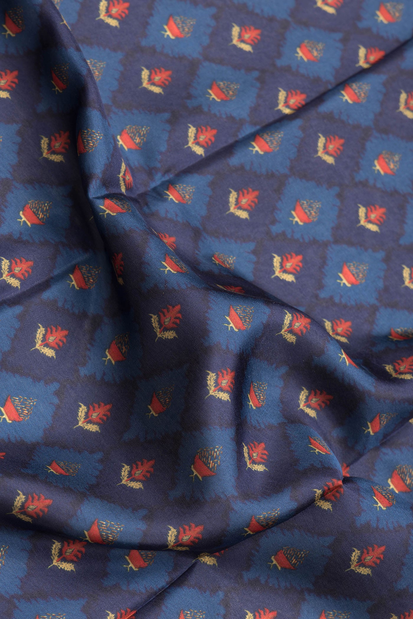 Close up of Navy Blue Dual Tone Printed Silk Saree with Printed design on the body and Plain Border.  displaying folds