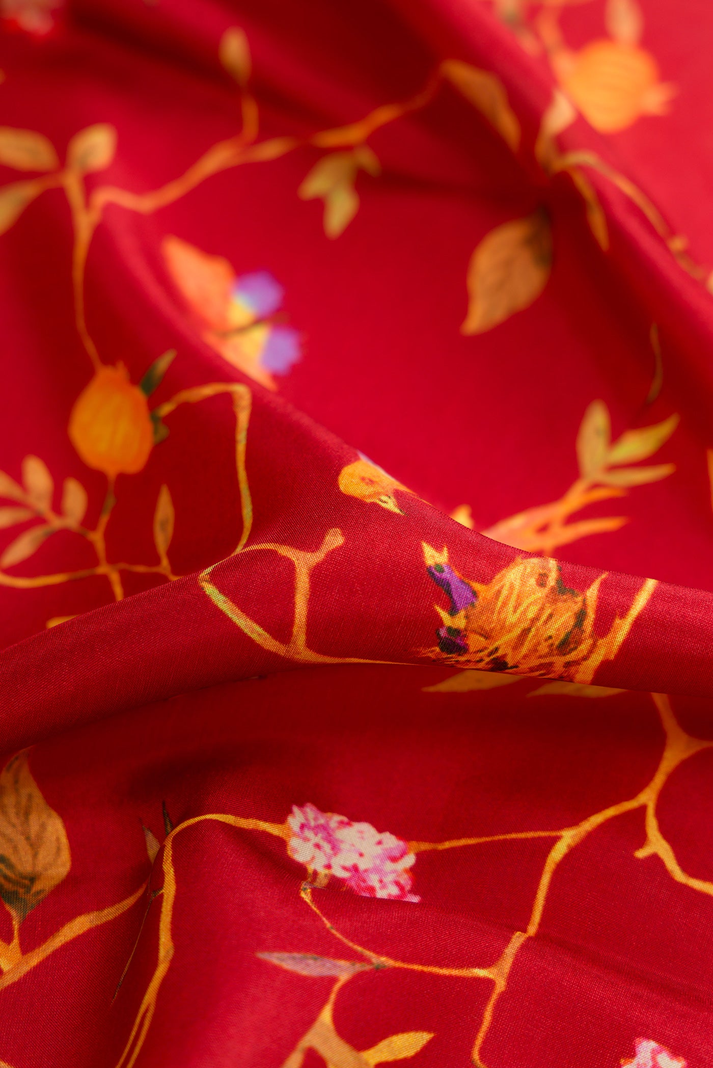Close up of Maroon Dual Tone Printed Silk Saree with Printed design on the body and Plain Border.  displaying folds