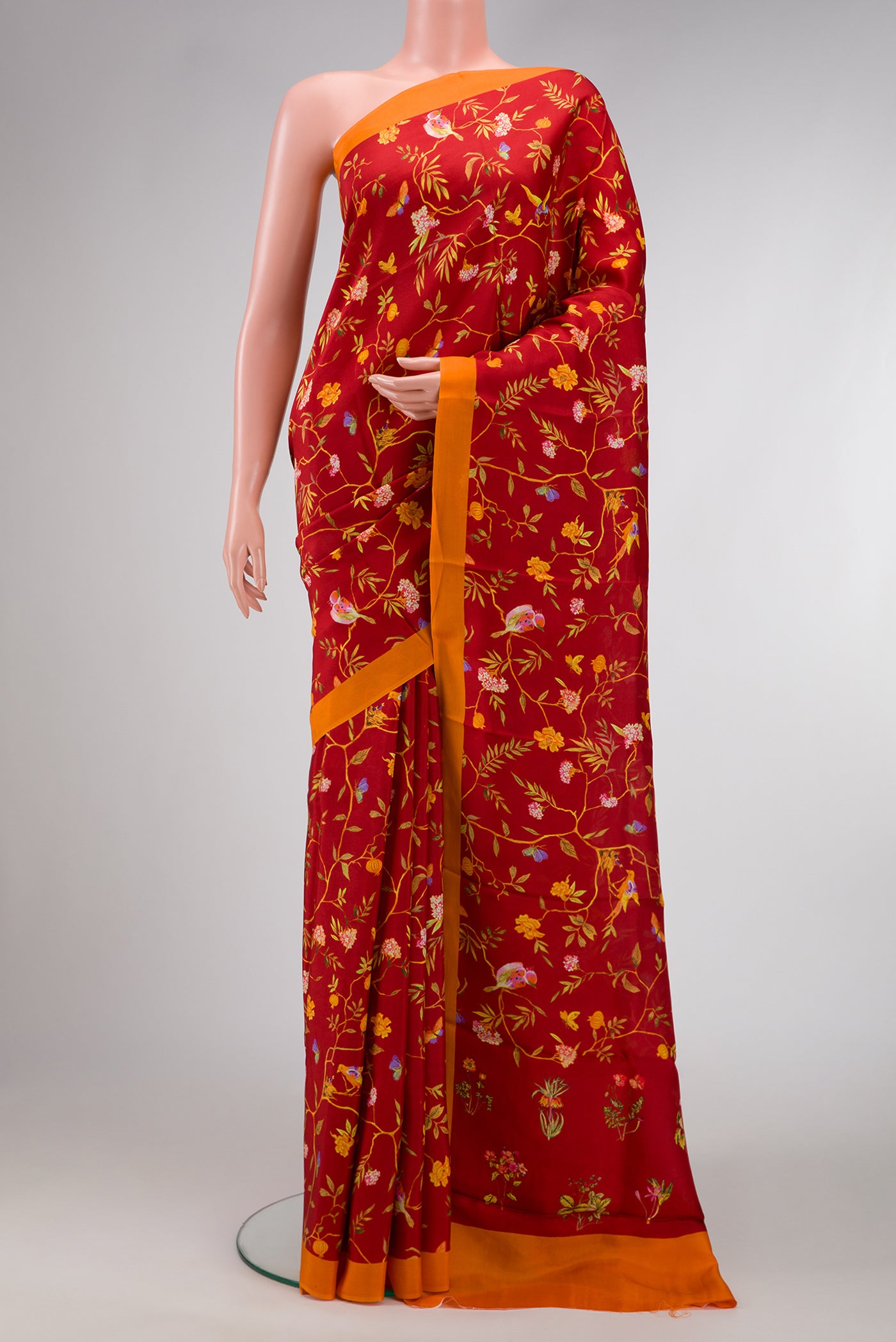 Maroon Dual Tone Printed Silk Saree with Printed design on the body and Plain Border.  displayed on a mannequin