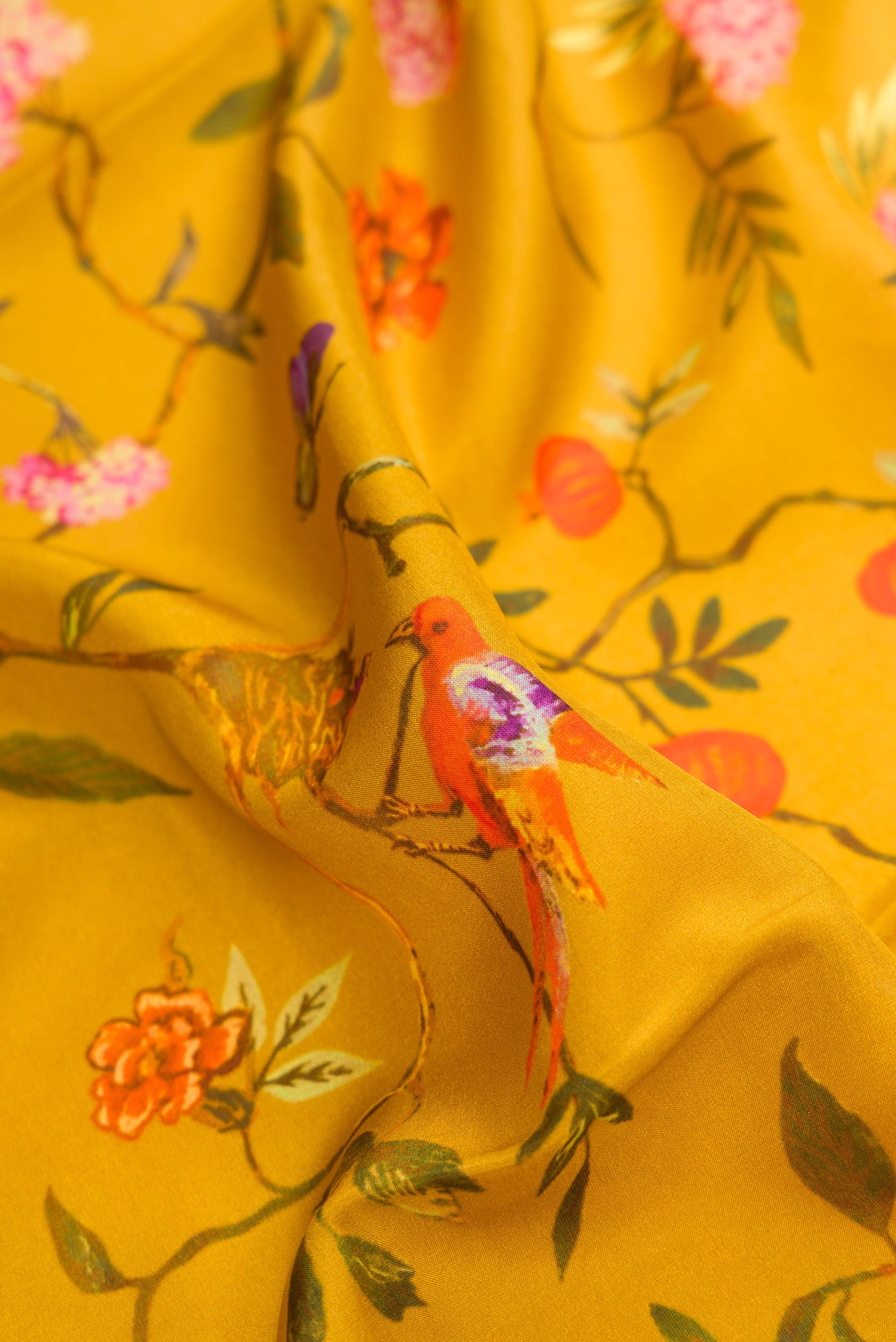 Close up of Mustard Dual Tone Printed Silk Saree with Printed design on the body and Plain Border.  displaying folds