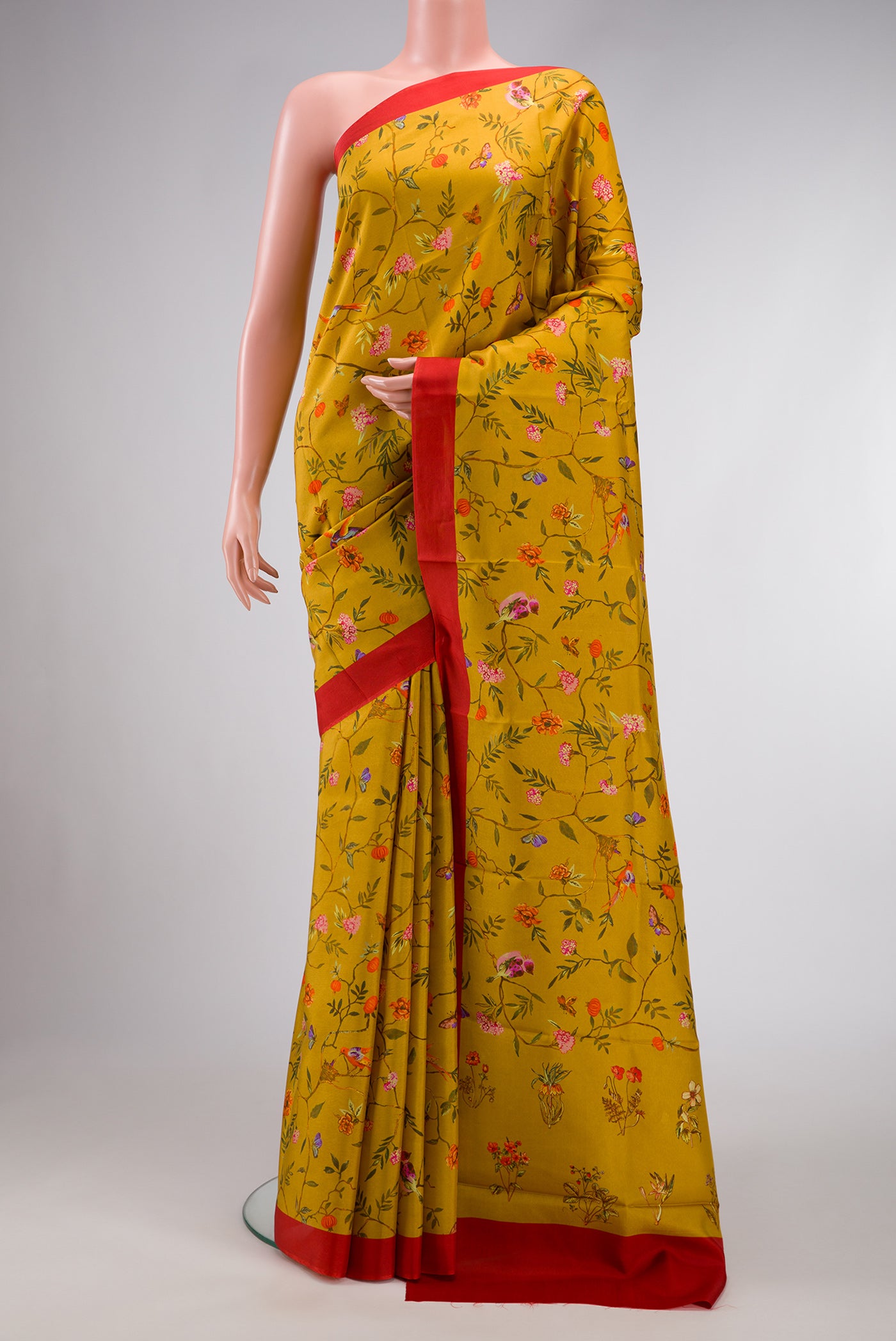 Mustard Dual Tone Printed Silk Saree with Printed design on the body and Plain Border.  displayed on a mannequin
