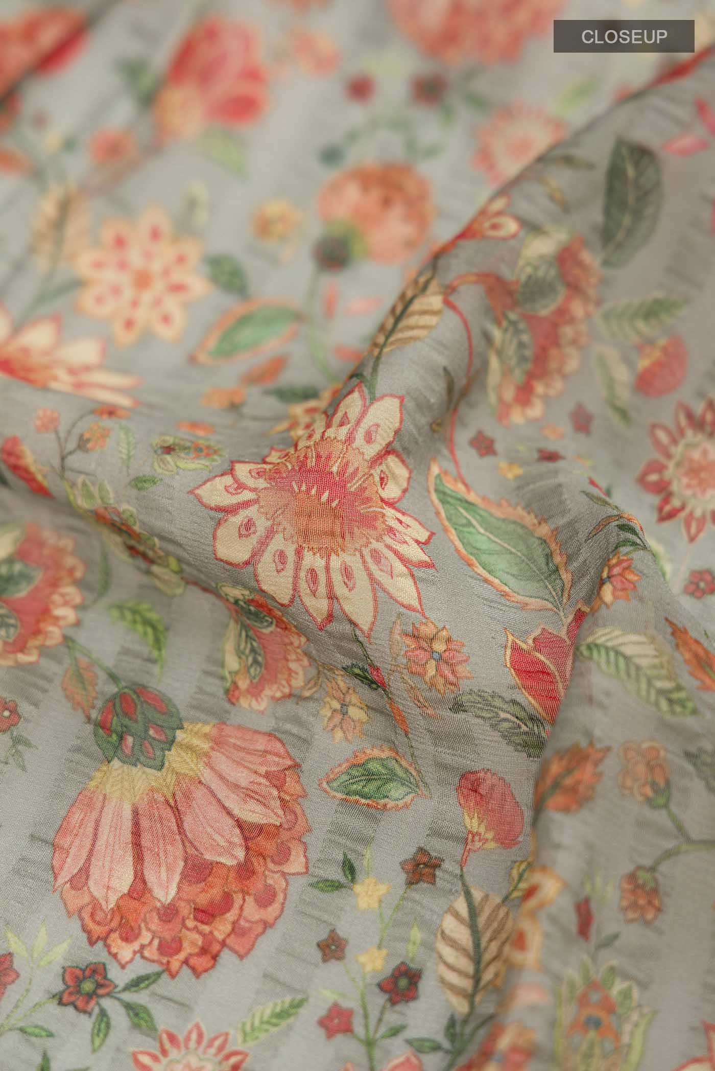 Close up of Green Mysore Chiffon Saree Printed design on the body and Plain Border displaying folds
