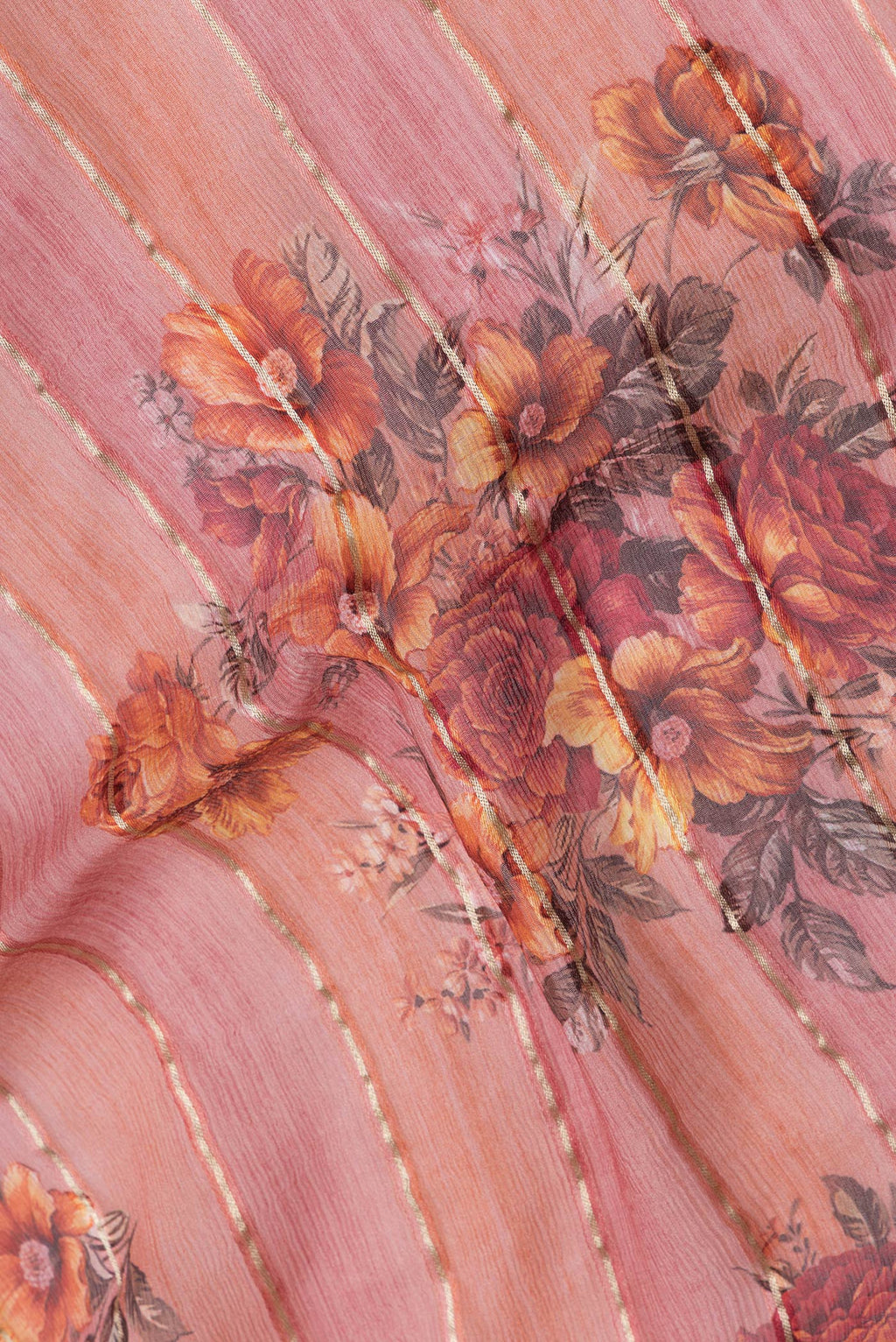 Close up of Golden Peach Dual Tone Mysore Georgette Saree with Stripes on the body and Zari Border.  displaying folds
