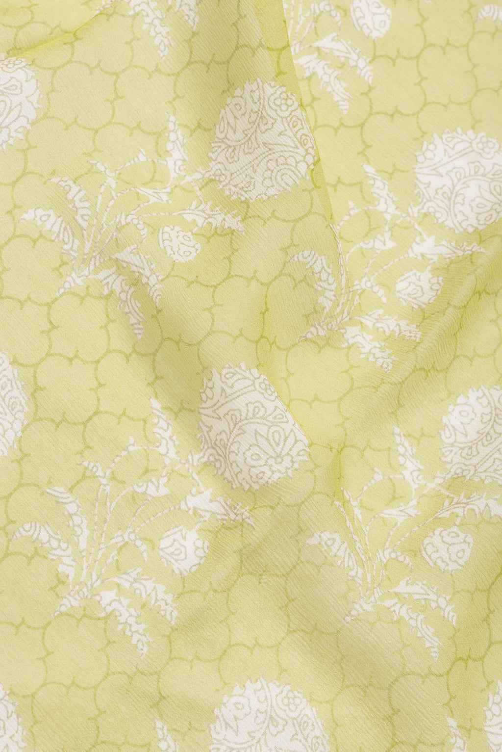Close up of Parrot Green Dual Tone Mysore Chiffon Saree with Printed design on the body and Zari Border.  displaying folds