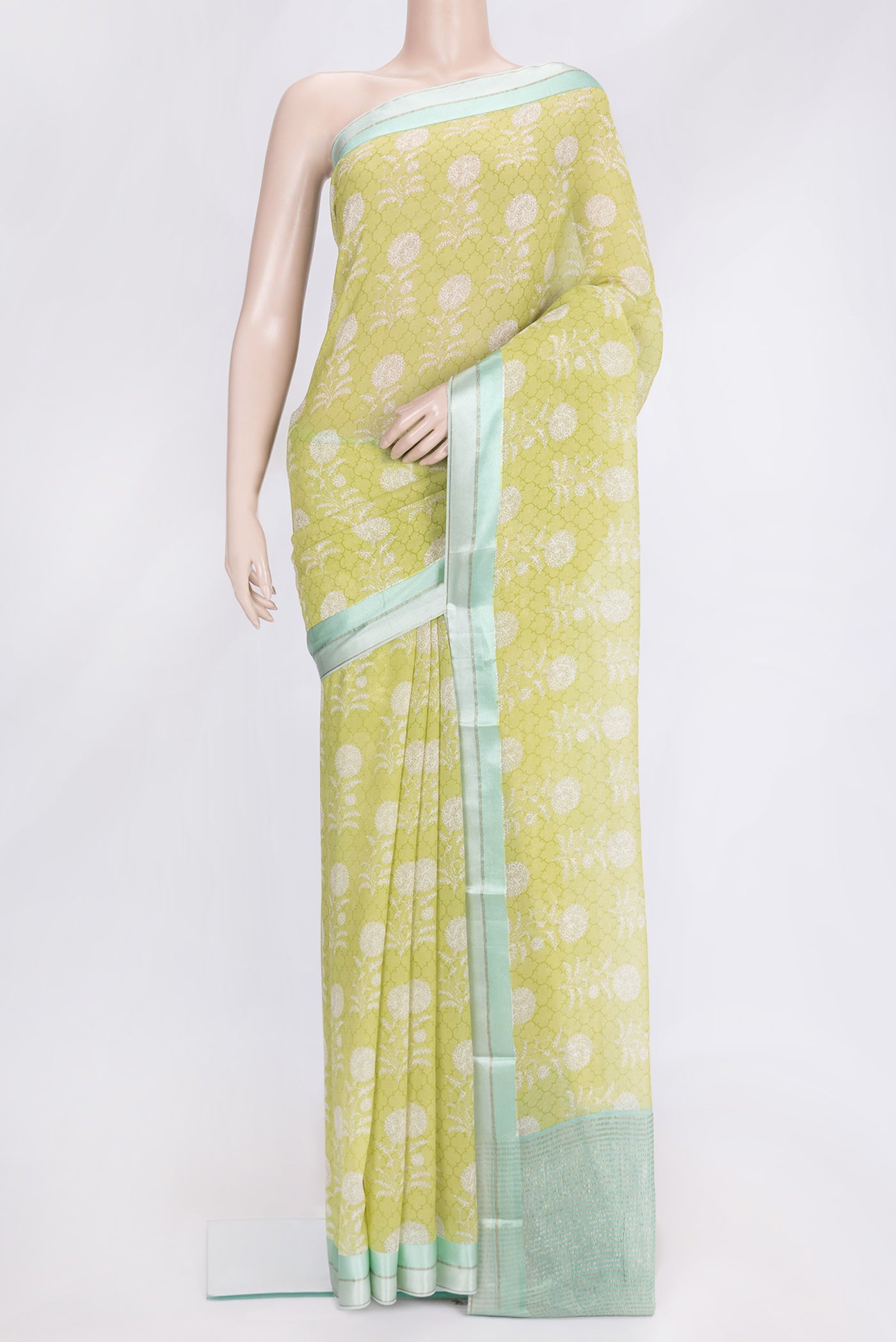 Parrot Green Dual Tone Mysore Chiffon Saree with Printed design on the body and Zari Border.  displayed on a mannequin