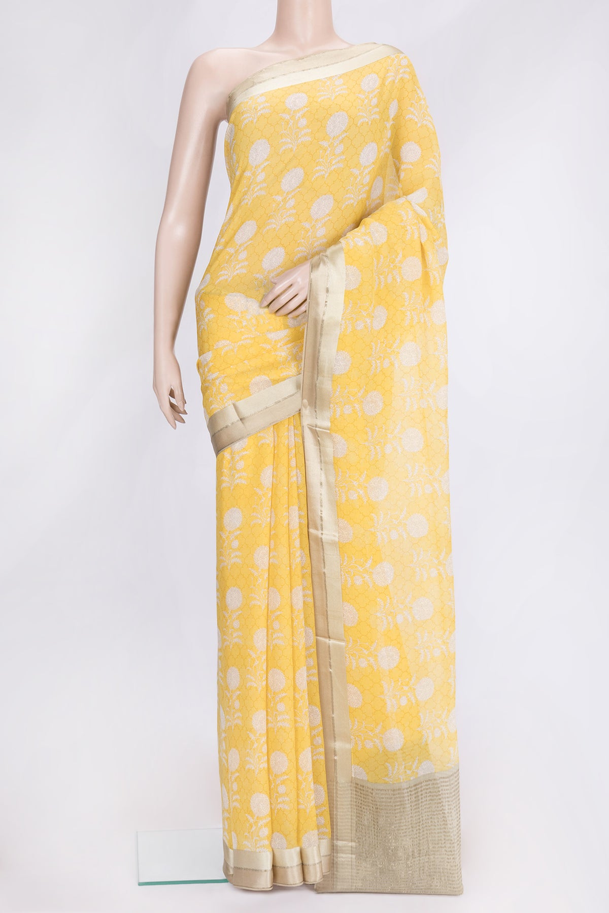 Yellow Dual Tone Mysore Chiffon Saree with Printed design on the body and Zari Border.  displayed on a mannequin