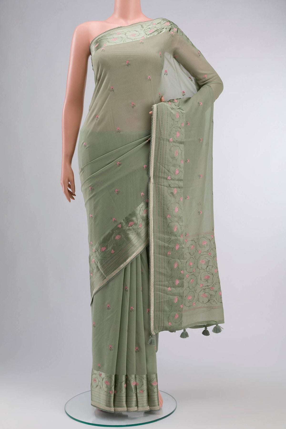 Green Mysore Georgette Saree with Embroidery on the body and Embroidery Border displayed on a mannequin