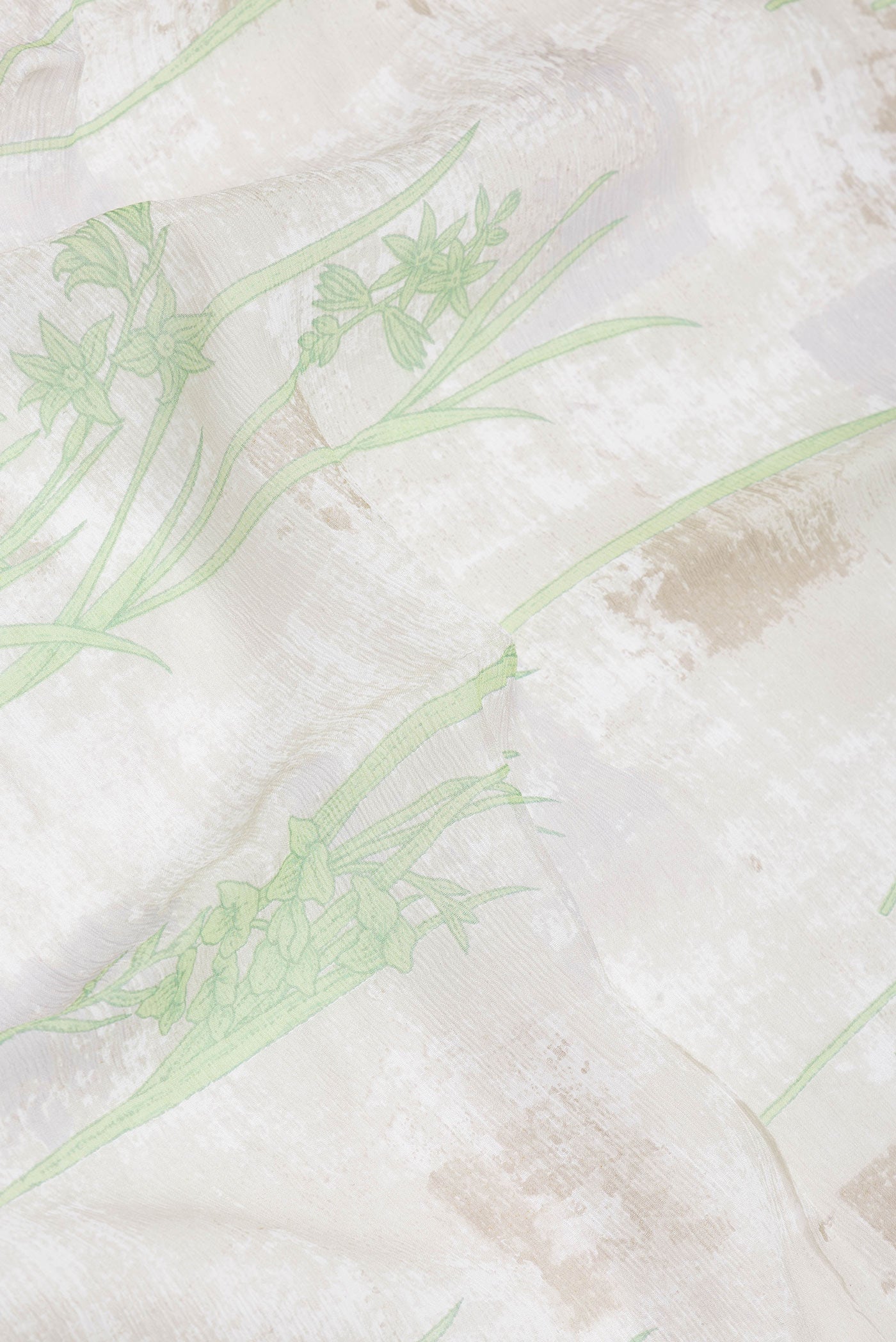 Close up of Beige Dual Tone Mysore Georgette Saree with Printed design on the body and Zari Border.  displaying folds