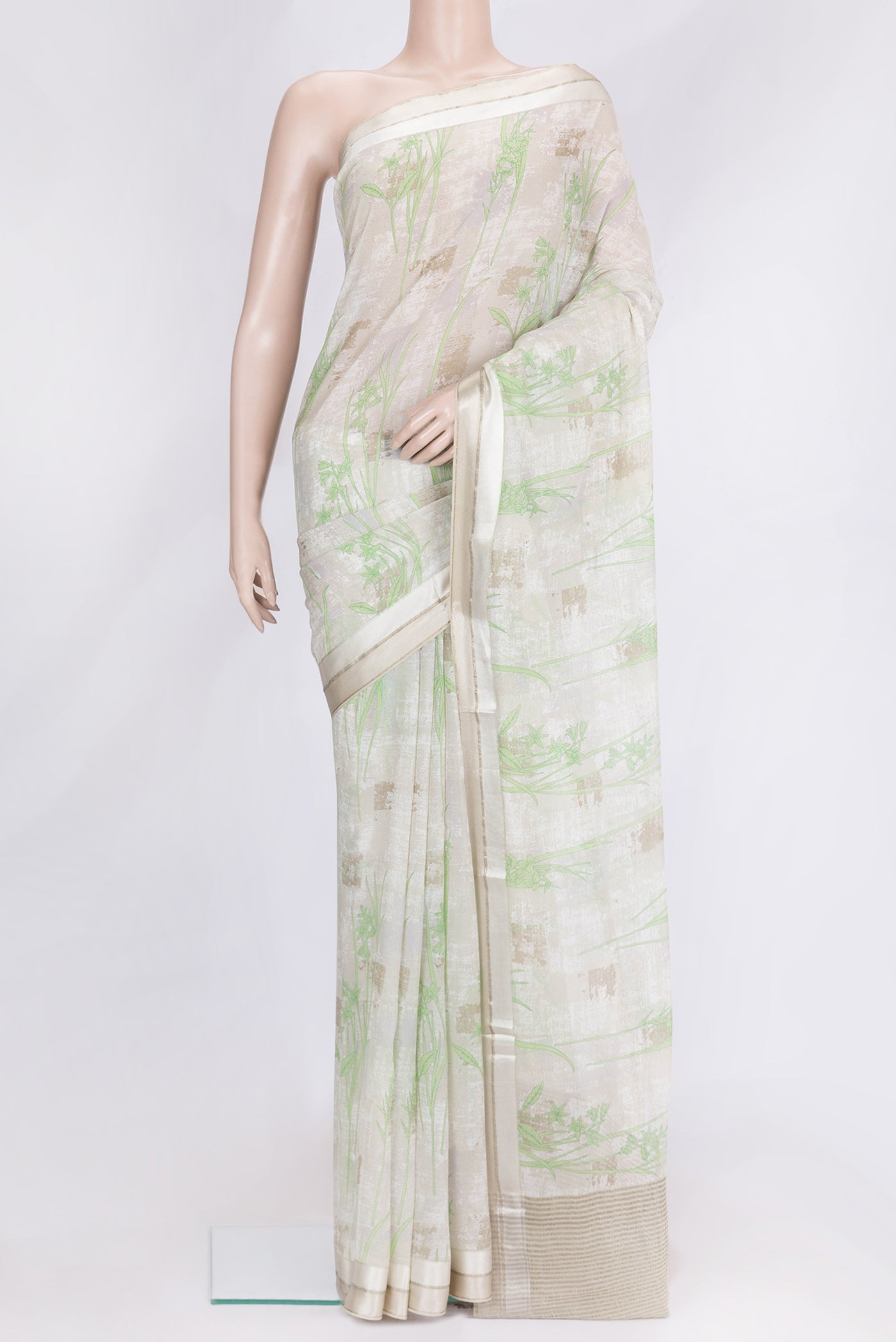 Beige Dual Tone Mysore Georgette Saree with Printed design on the body and Zari Border.  displayed on a mannequin