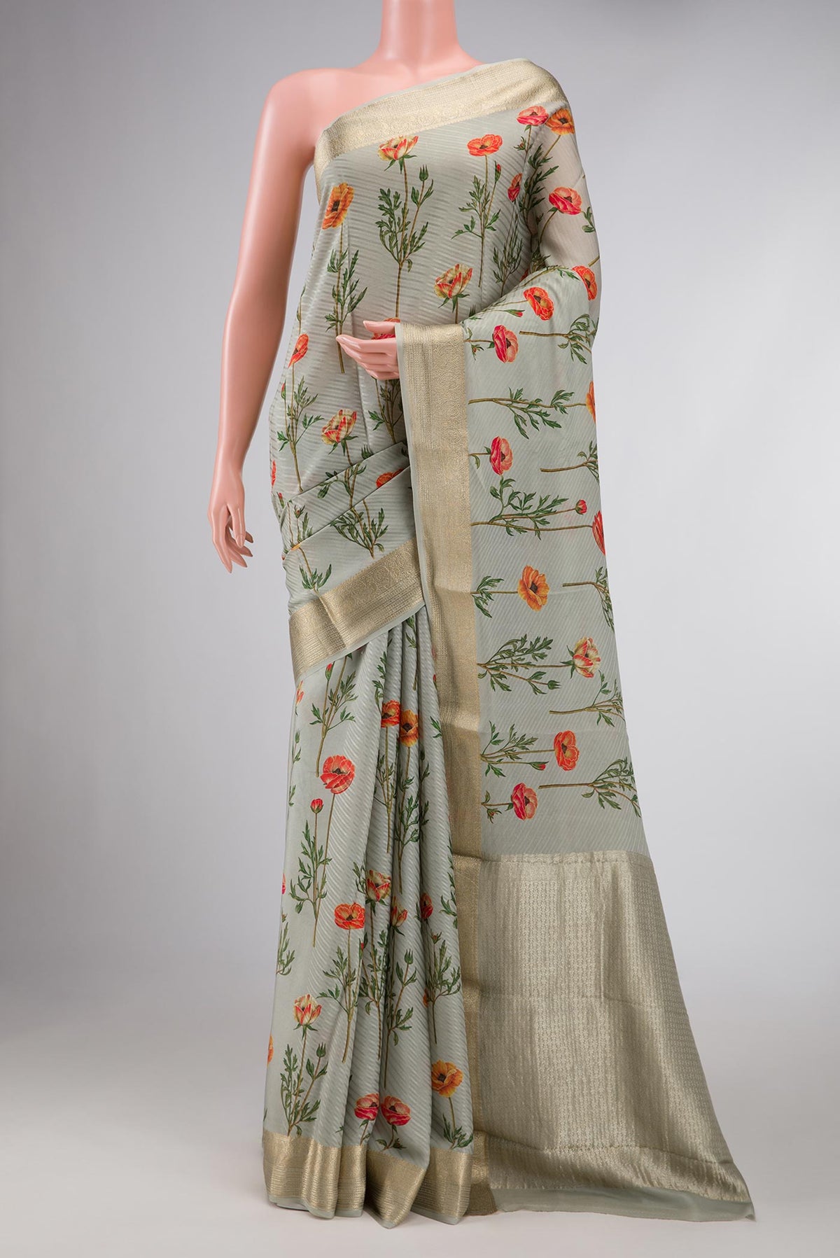 Green Dual Tone Mysore Crepe Saree with Printed design on the body and Zari Border displayed on a mannequin