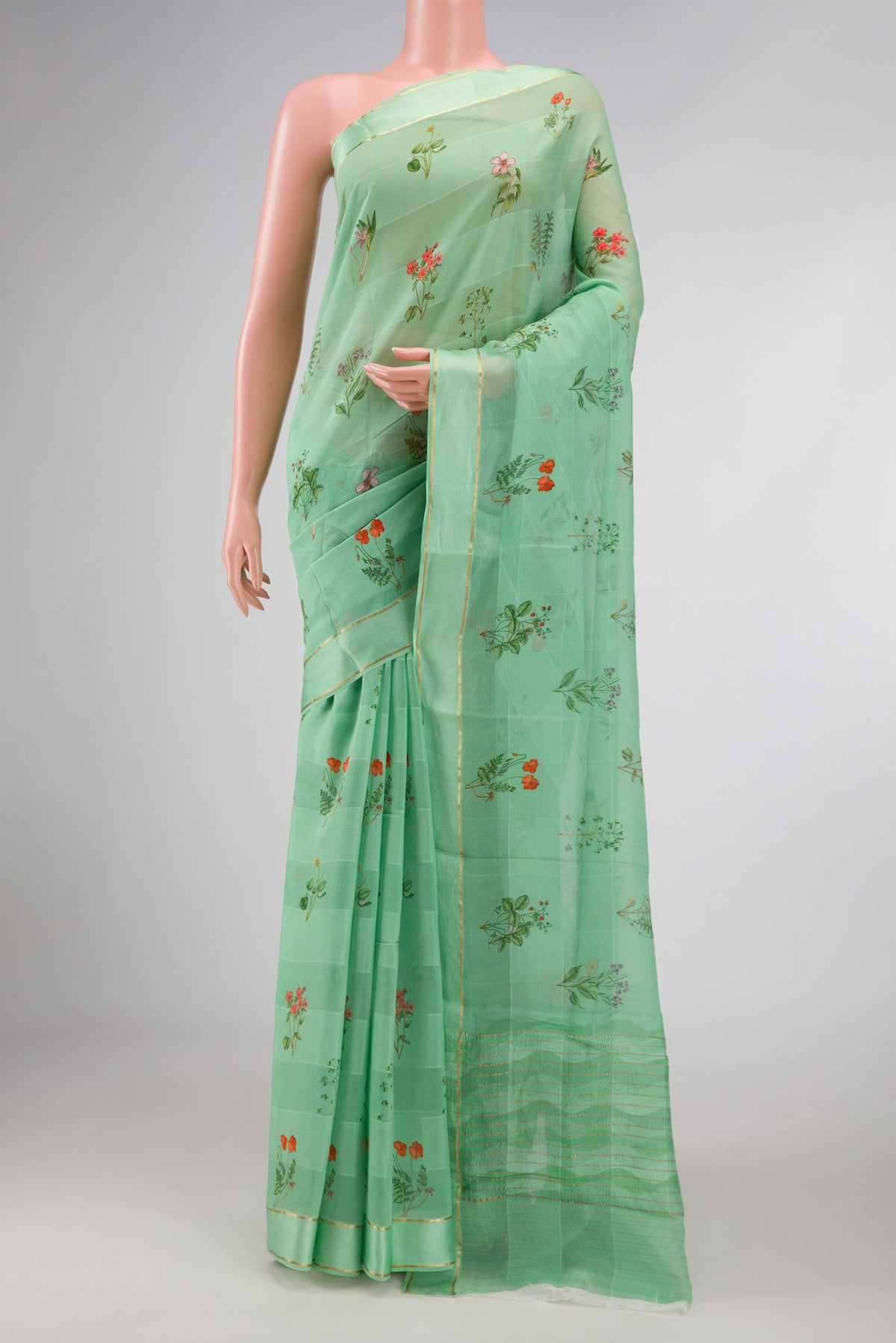 Green Dual Tone Mysore Georgette Saree with Printed design on the body and Zari Border displayed on a mannequin