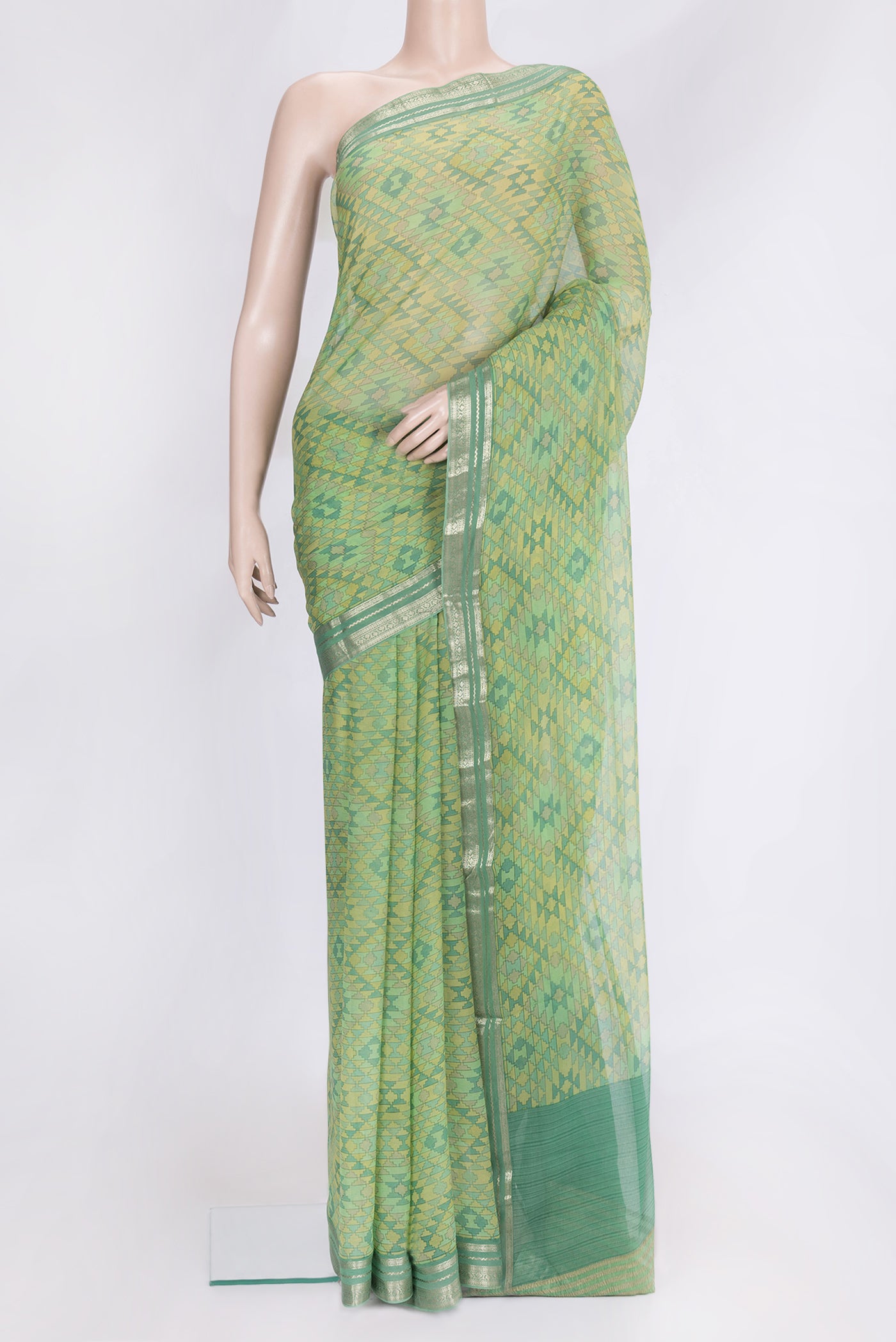 Green Dual Tone Mysore Chiffon Saree with Printed design on the body and Zari Border.  displayed on a mannequin