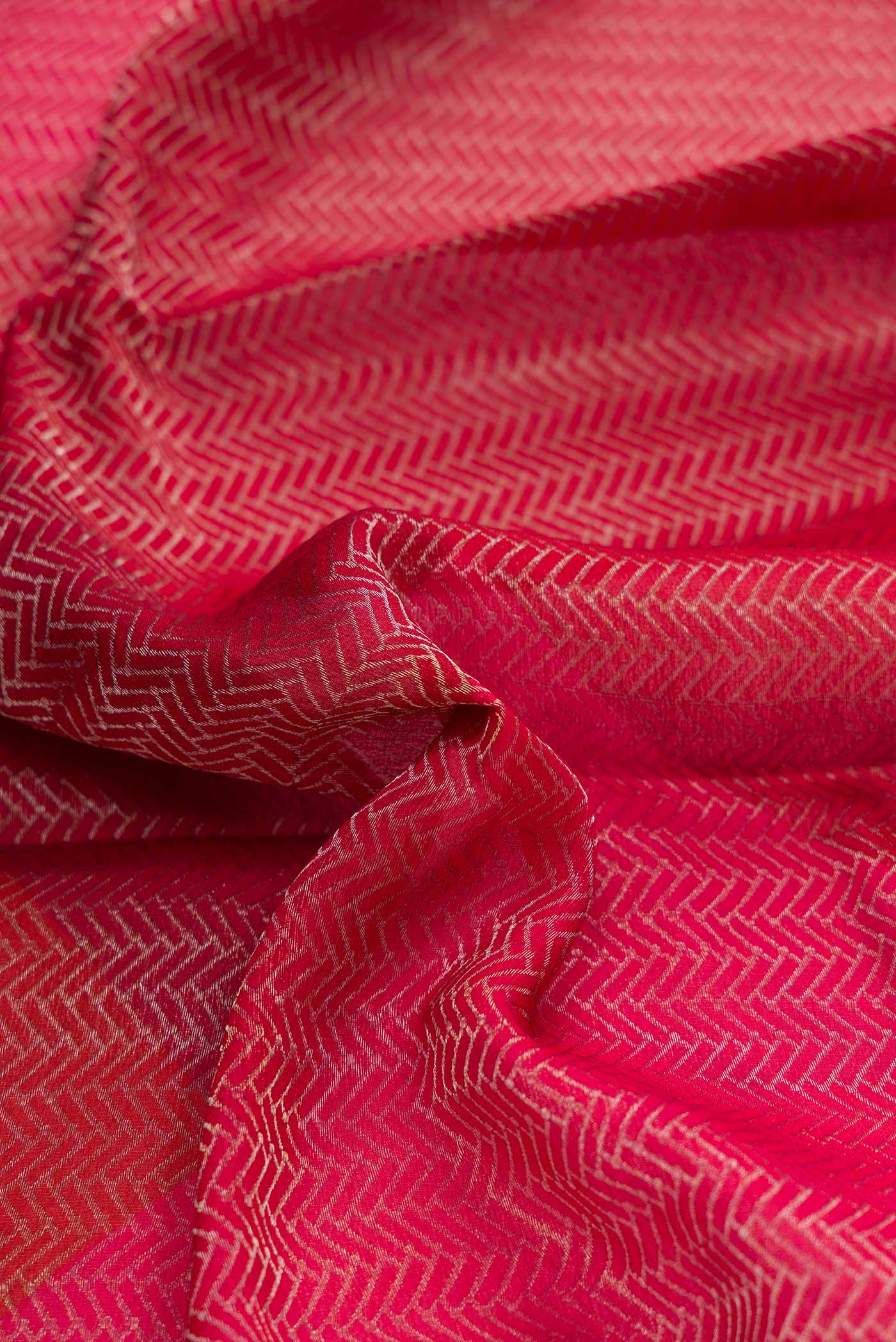 Close up of Maroon Dual Tone Mysore Georgette Saree with Zari Brocade on the body and Zari Border displaying folds