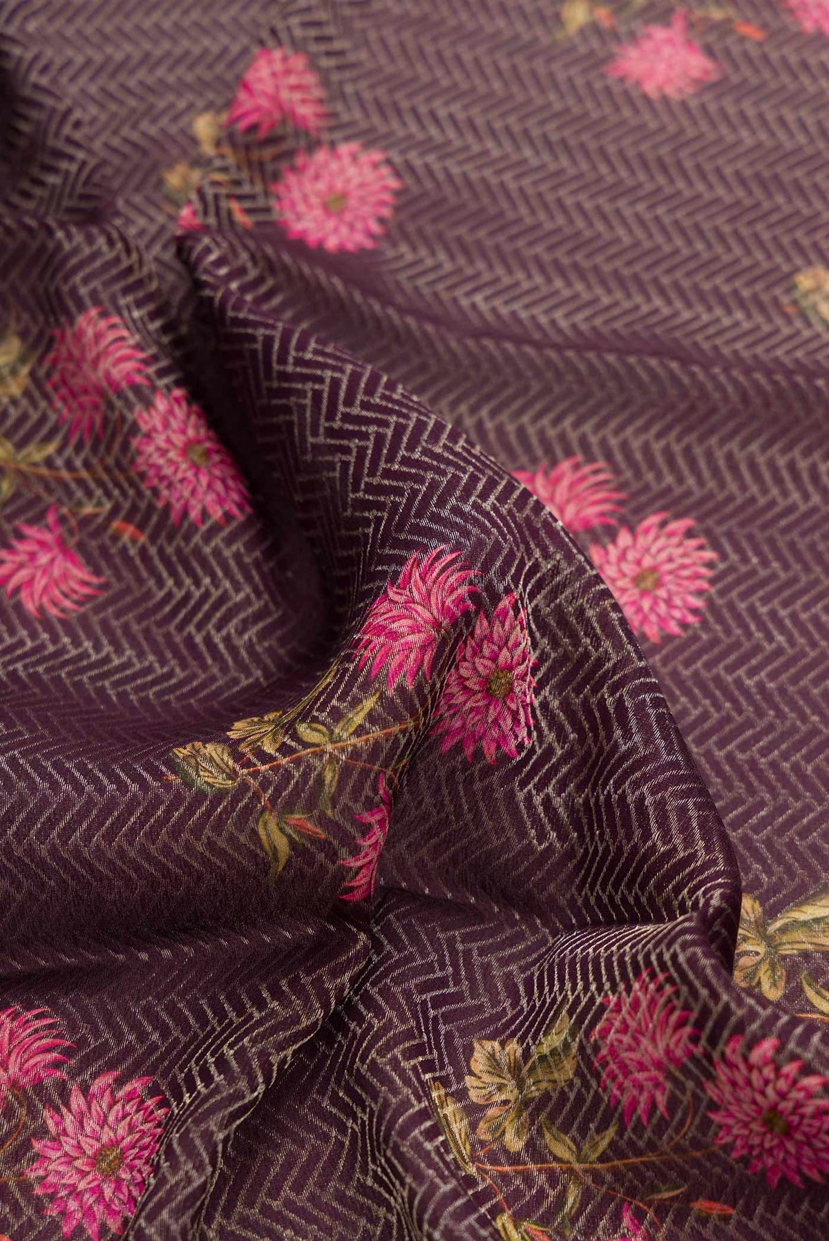 Close up of Burgundy Dual Tone Mysore Georgette Saree with Zari Brocade on the body and Zari And Thread Border displaying folds