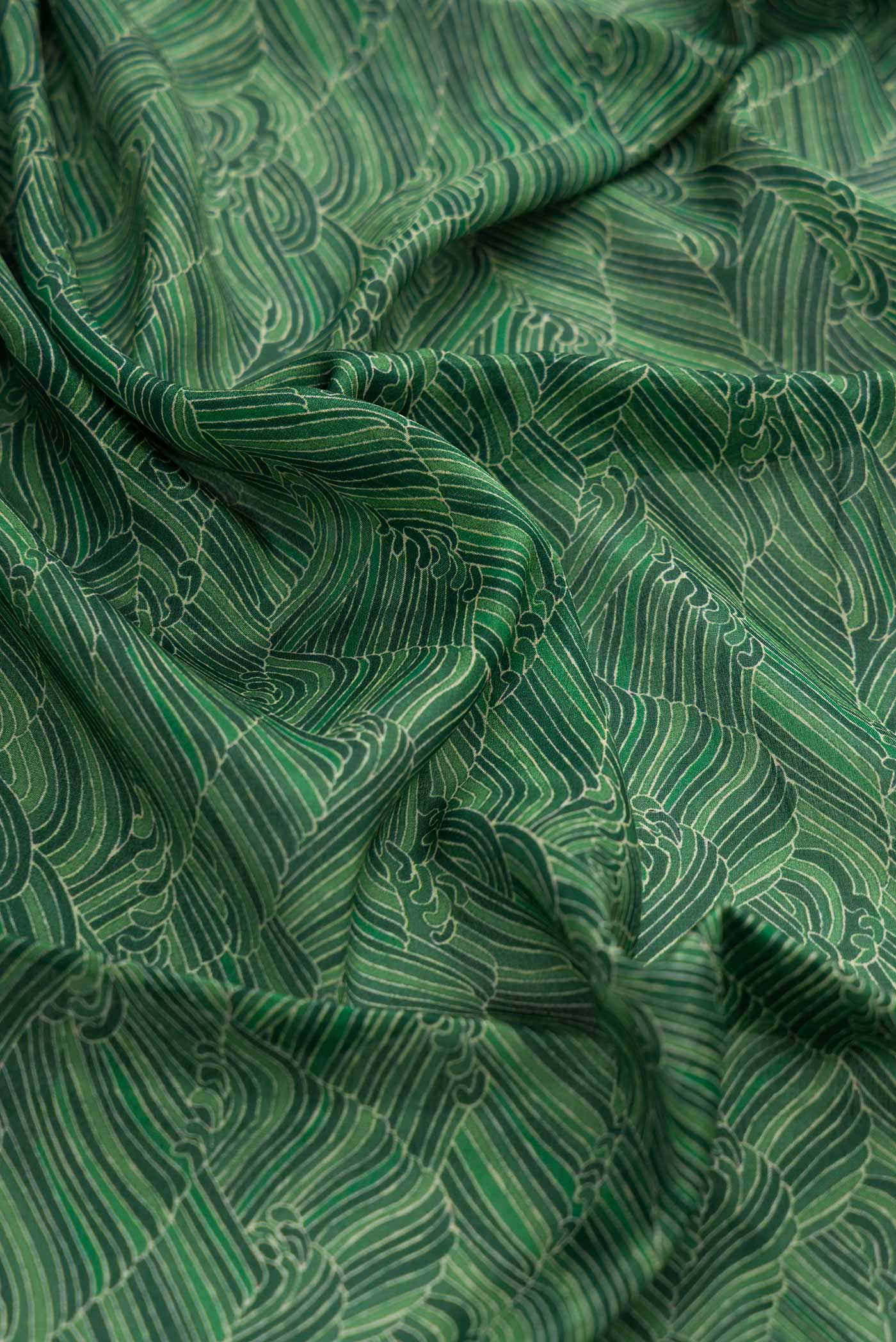 Close up of Green Dual Tone Mysore Crepe Saree with Zari Brocade on the body and Zari Border displaying folds