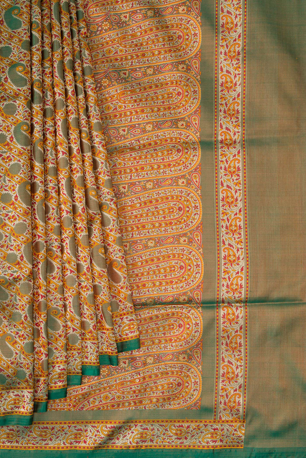 Pleats and pallu of Green Dual Tone Banarasi Tanchoi Silk Saree with Jacquard design on the body and Fancy Border. 