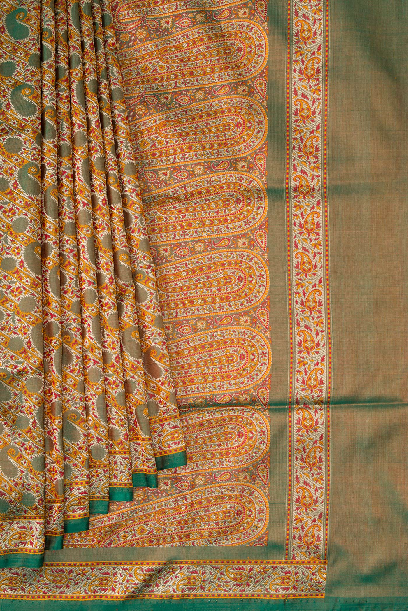 Pleats and pallu of Green Dual Tone Banarasi Tanchoi Silk Saree with Jacquard design on the body and Fancy Border. 