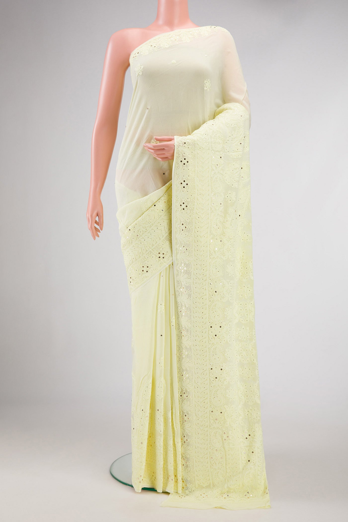 Lemon Yellow Dual Tone Georgette Saree with Embroidery on the body and Embroidery Border.  displayed on a mannequin