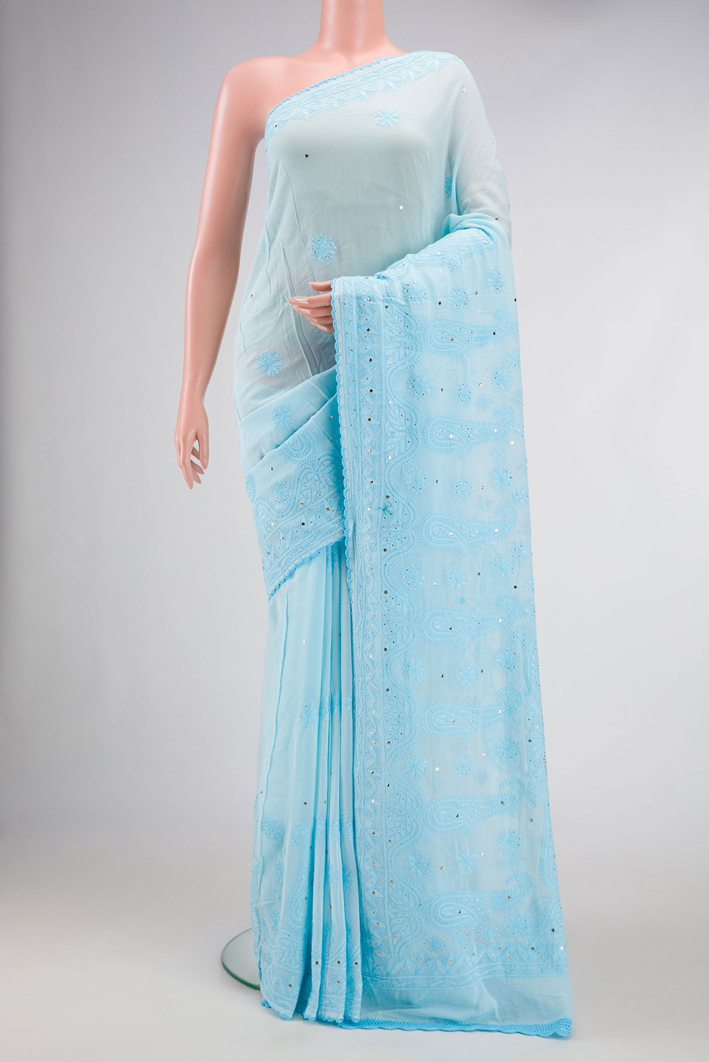 Sky Blue Dual Tone Georgette Saree with Embroidery on the body and Embroidery Border.  displayed on a mannequin