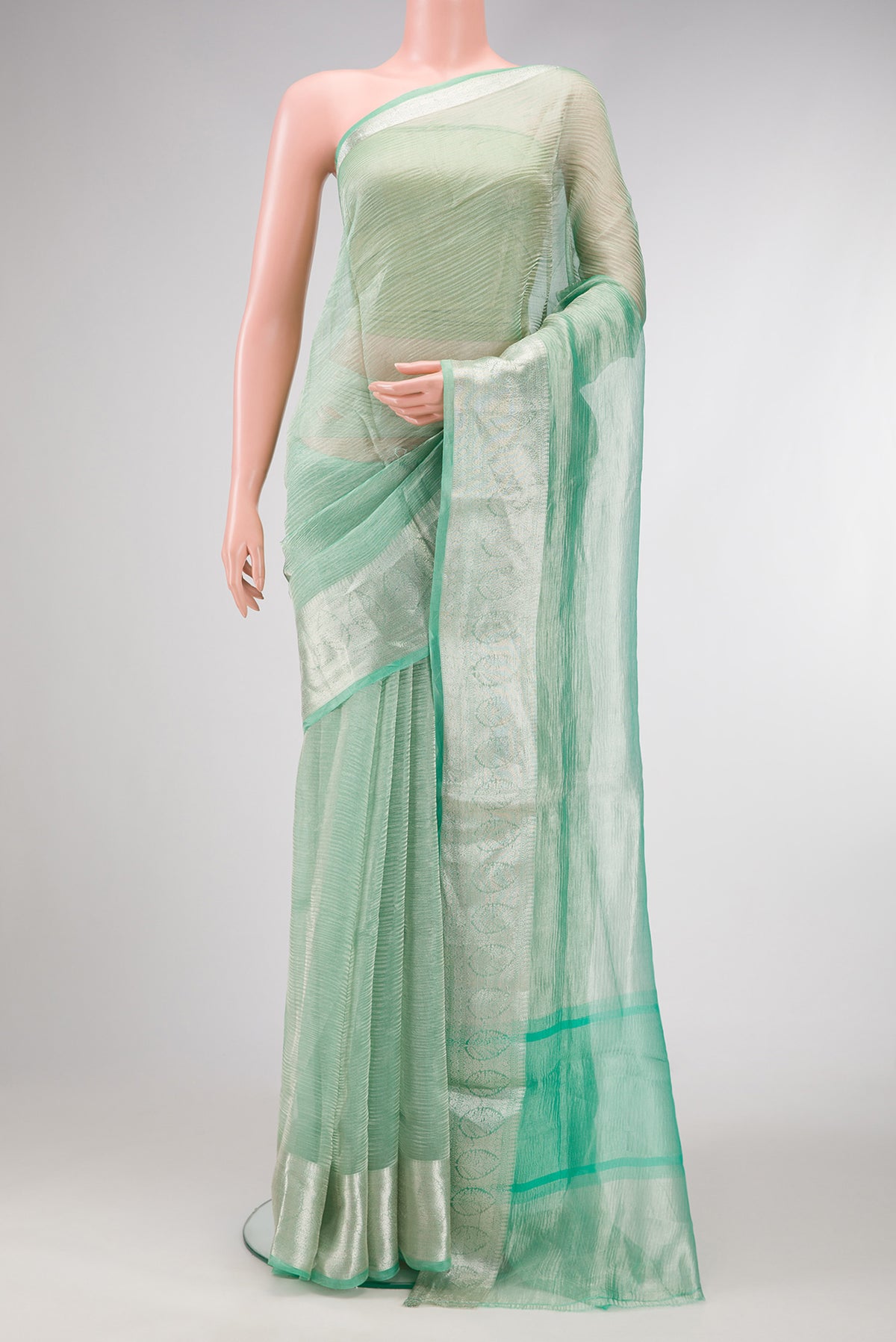 Sea Green Dual Tone Organza Silk Saree with Plain Body and Zari Border.  displayed on a mannequin