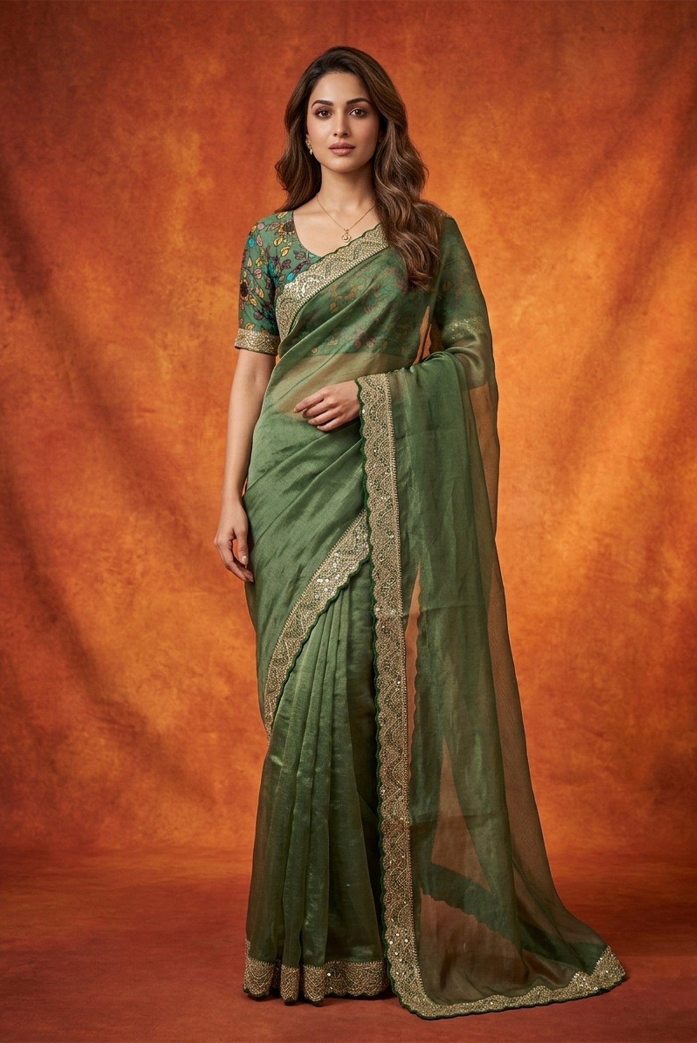 Model wearing a Green with Gold Color Organza Silk Saree with Plain Body and Embroidery Border.