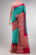 Sky Blue Dual Tone Bandhani Silk Saree with Bandhani Print on the body and Zari Border.  displayed on a mannequin