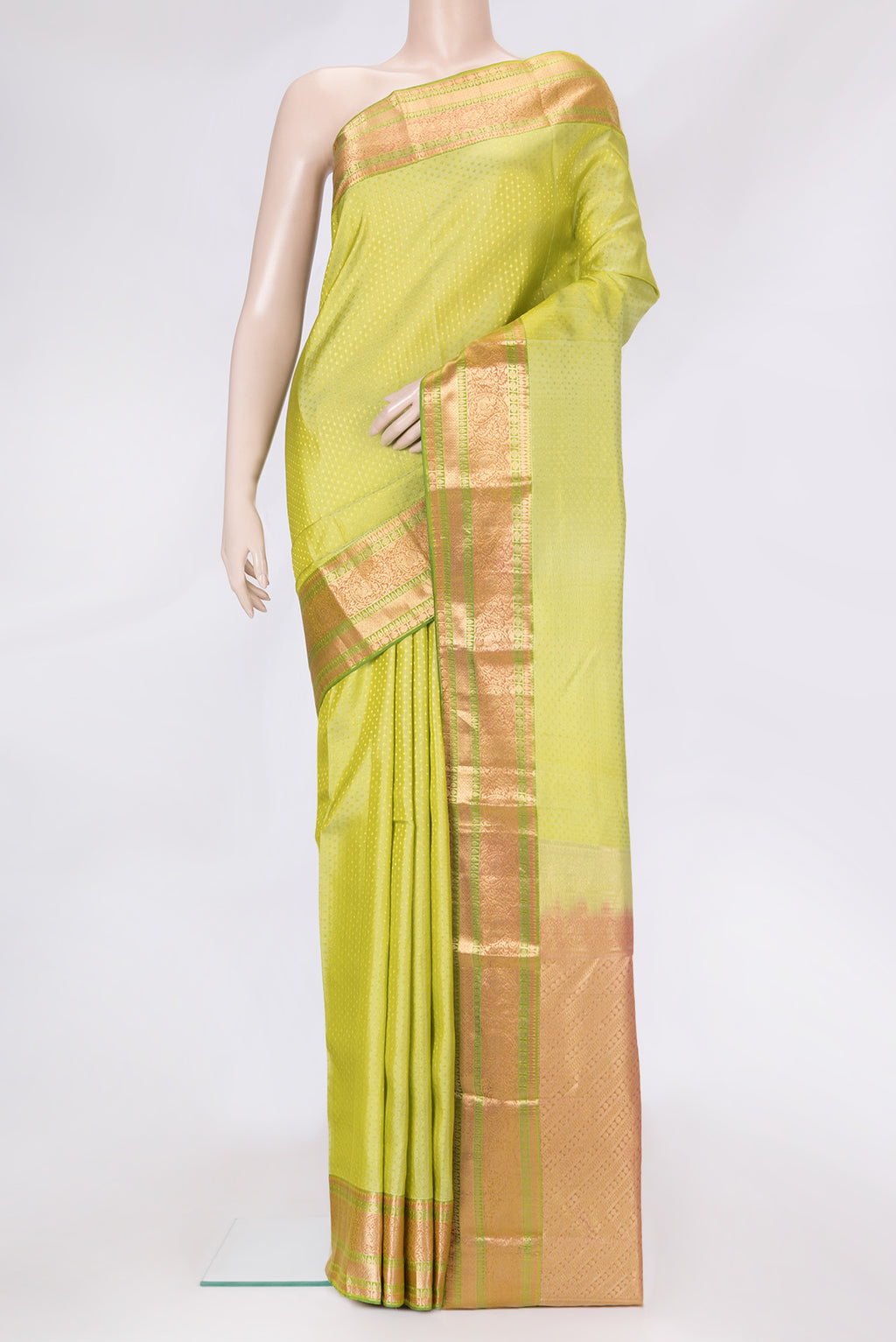 Pista Green Dual Tone Kanchipuram Silk Saree with Zari Butta on the body and Zari Border.  displayed on a mannequin