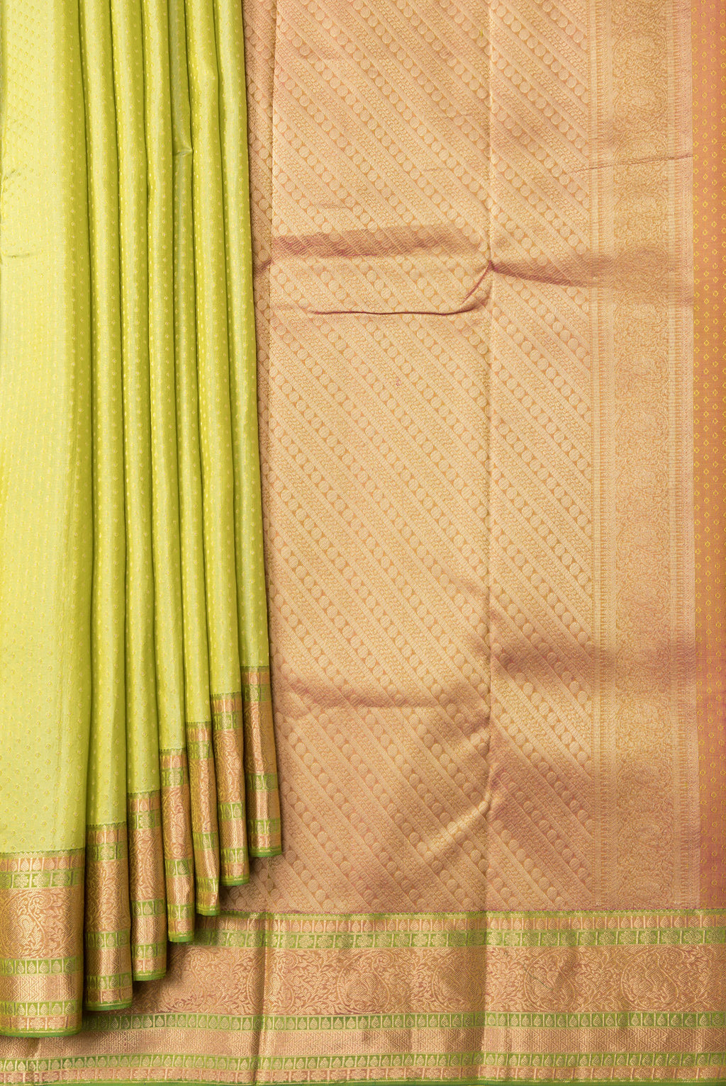 Pleats and pallu of Pista Green Dual Tone Kanchipuram Silk Saree with Zari Butta on the body and Zari Border. 