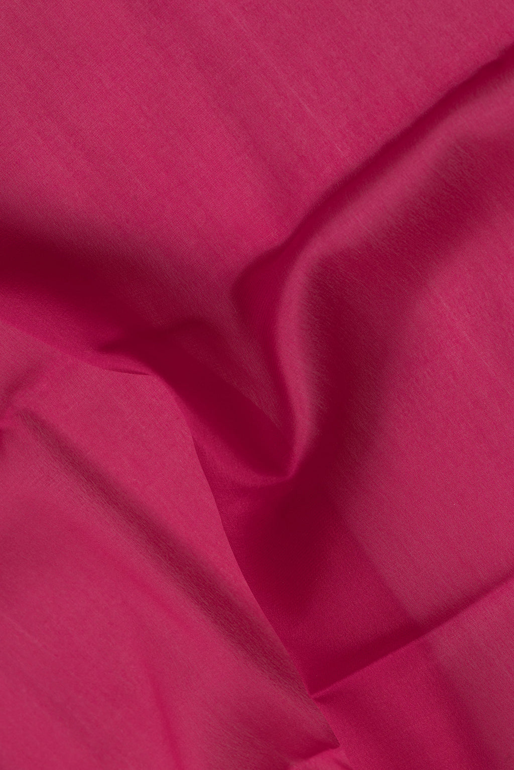 Close up of Pink Mysore Crepe Saree with Plain Body and Zari Border.  displaying folds