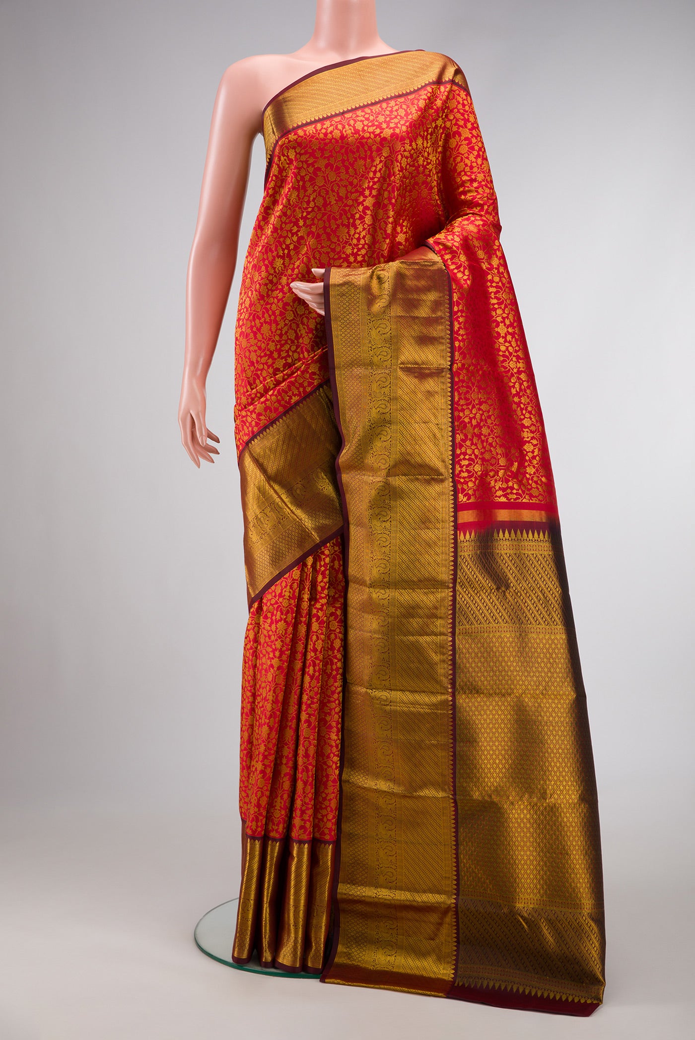 Dark Pink Dual Tone Kanchipuram Silk Saree with Zari Brocade on the body and Zari Border.  displayed on a mannequin