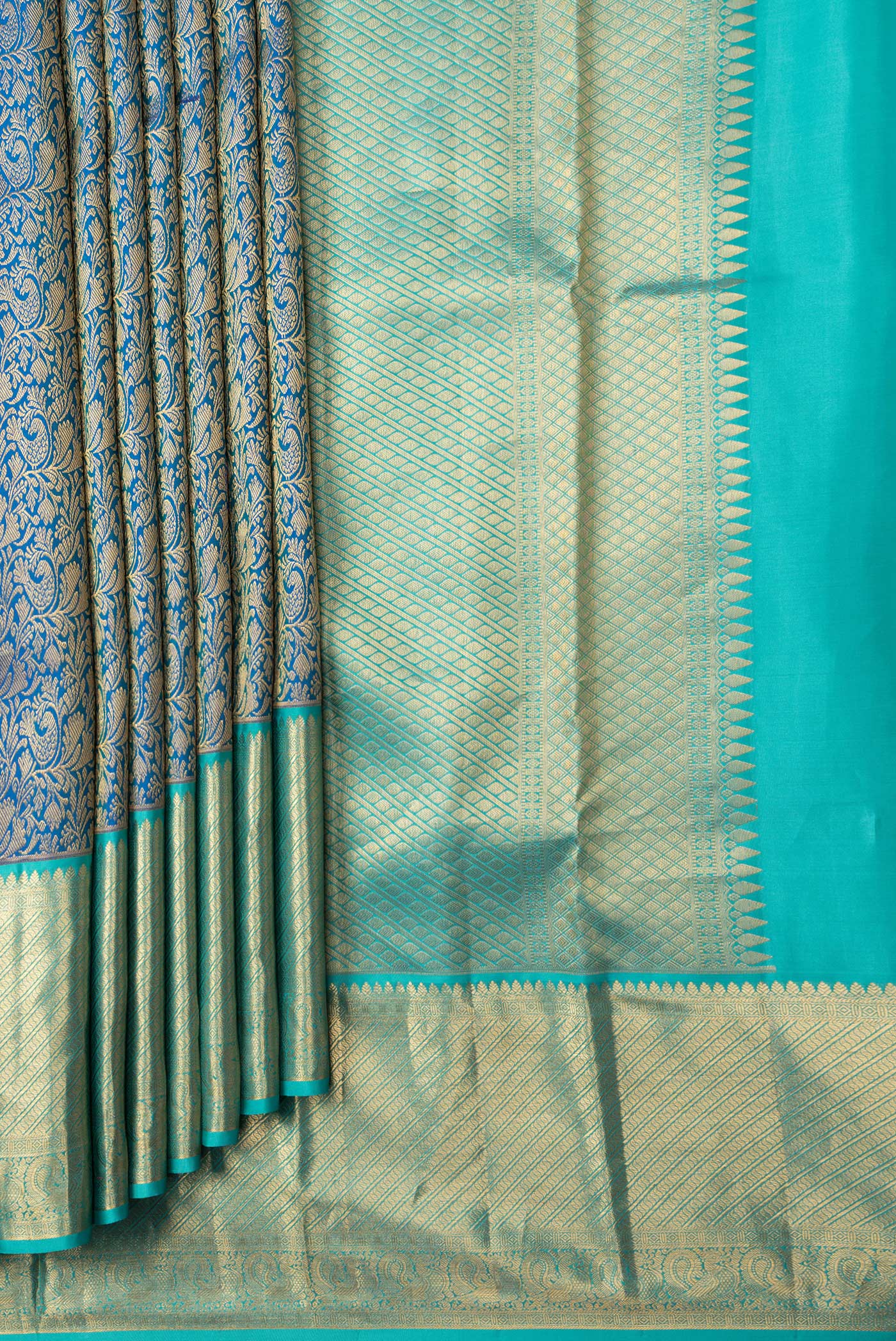 Pleats and pallu of Royal Blue Dual Tone Kanchipuram Silk Saree with Zari Brocade on the body and Zari Border. 