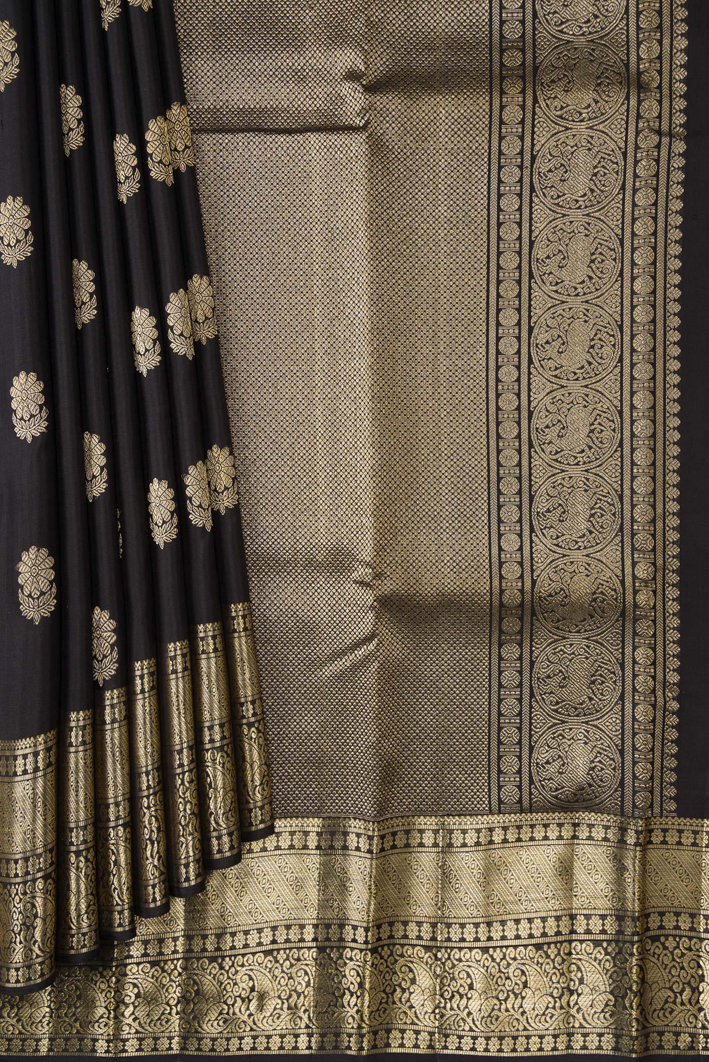 Pleats and pallu of Black Dual Tone Kanjivaram Silk Saree with Zari Butta on the body and Zari Border. 