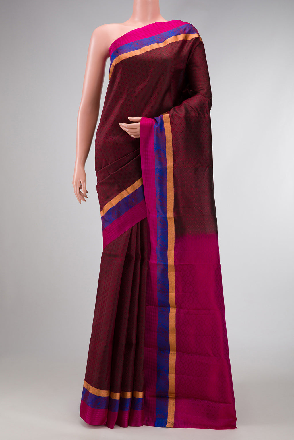 Maroon Dual Tone Kanchipuram Silk Saree with Jacquard design on the body and Fancy Border.  displayed on a mannequin