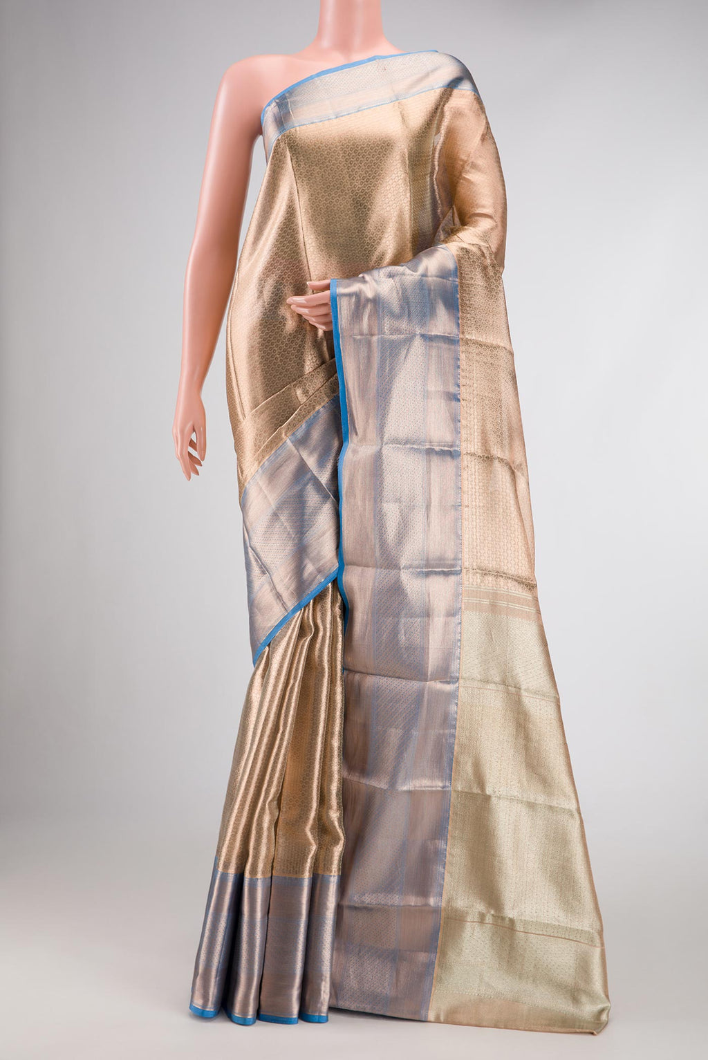 Gold Dual Tone Kanchipuram Tissue Silk Saree with Zari Brocade on the body and Zari Border.  displayed on a mannequin