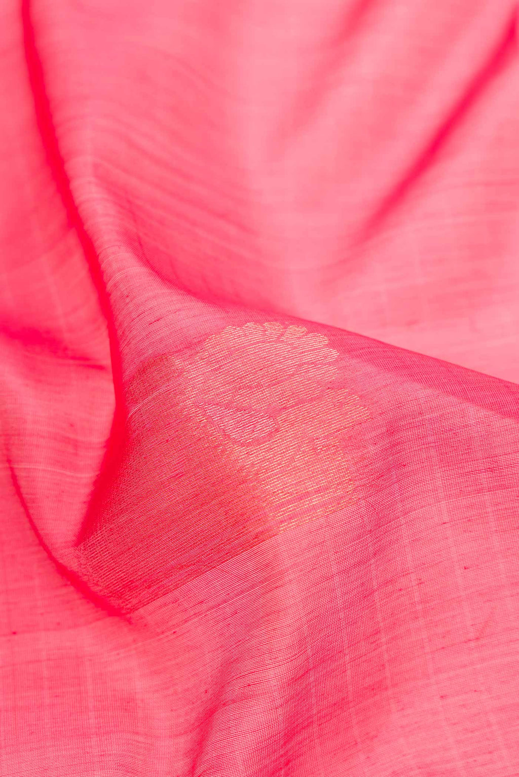 Close up of Pink Dual Tone Silk Cotton Saree with Zari Butta on the body and Zari Border.  displaying folds