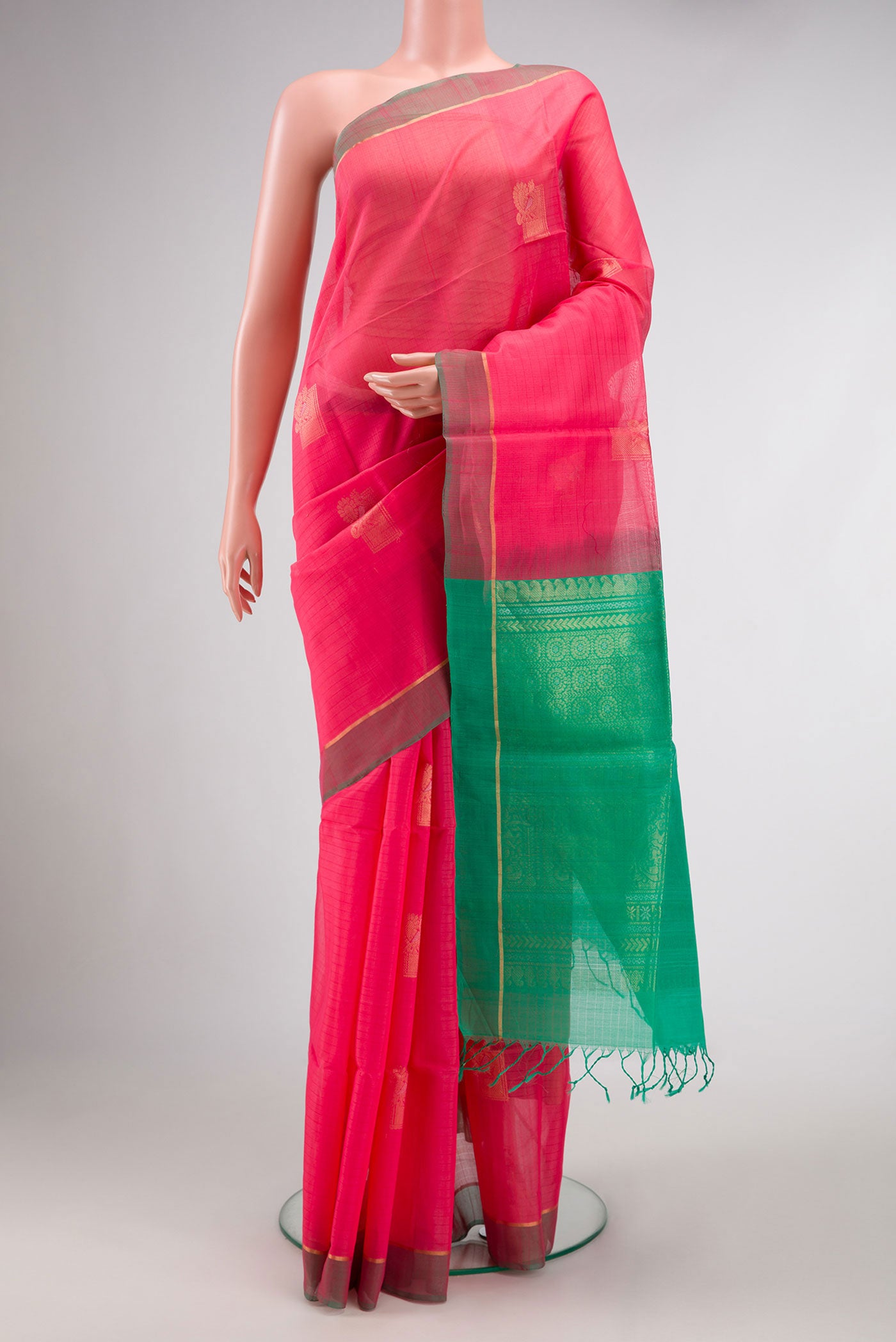 Pink Dual Tone Silk Cotton Saree with Zari Butta on the body and Zari Border.  displayed on a mannequin