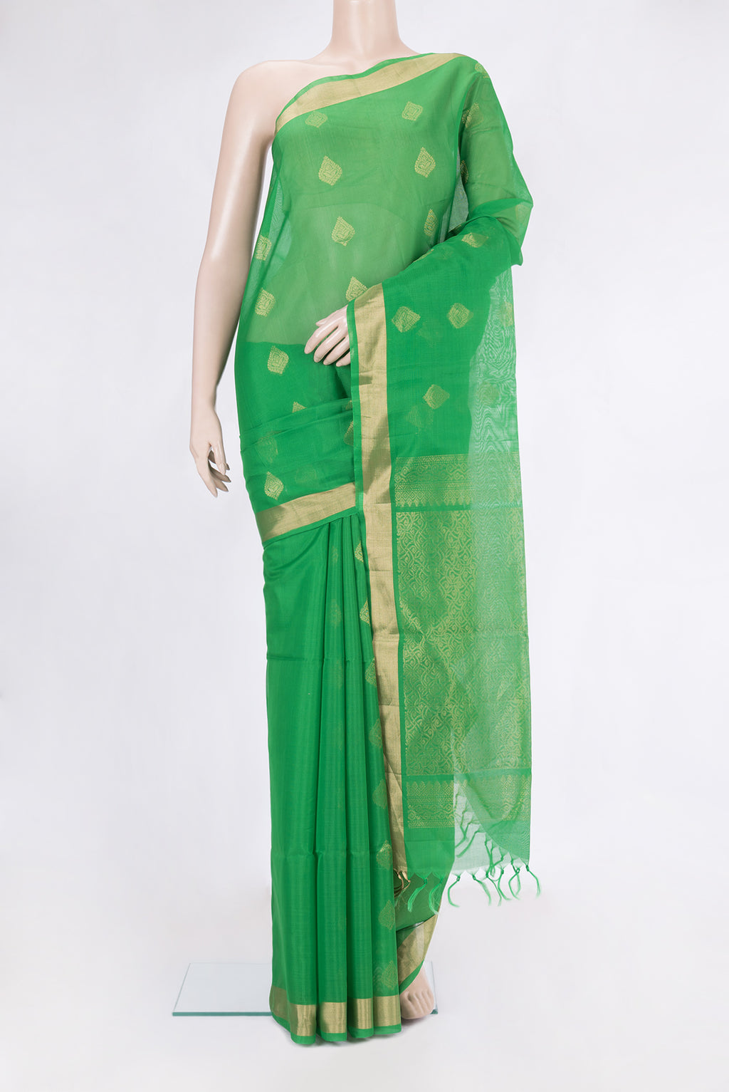 Green Silk Cotton Saree with Zari Butta on the body and Zari Border.  displayed on a mannequin