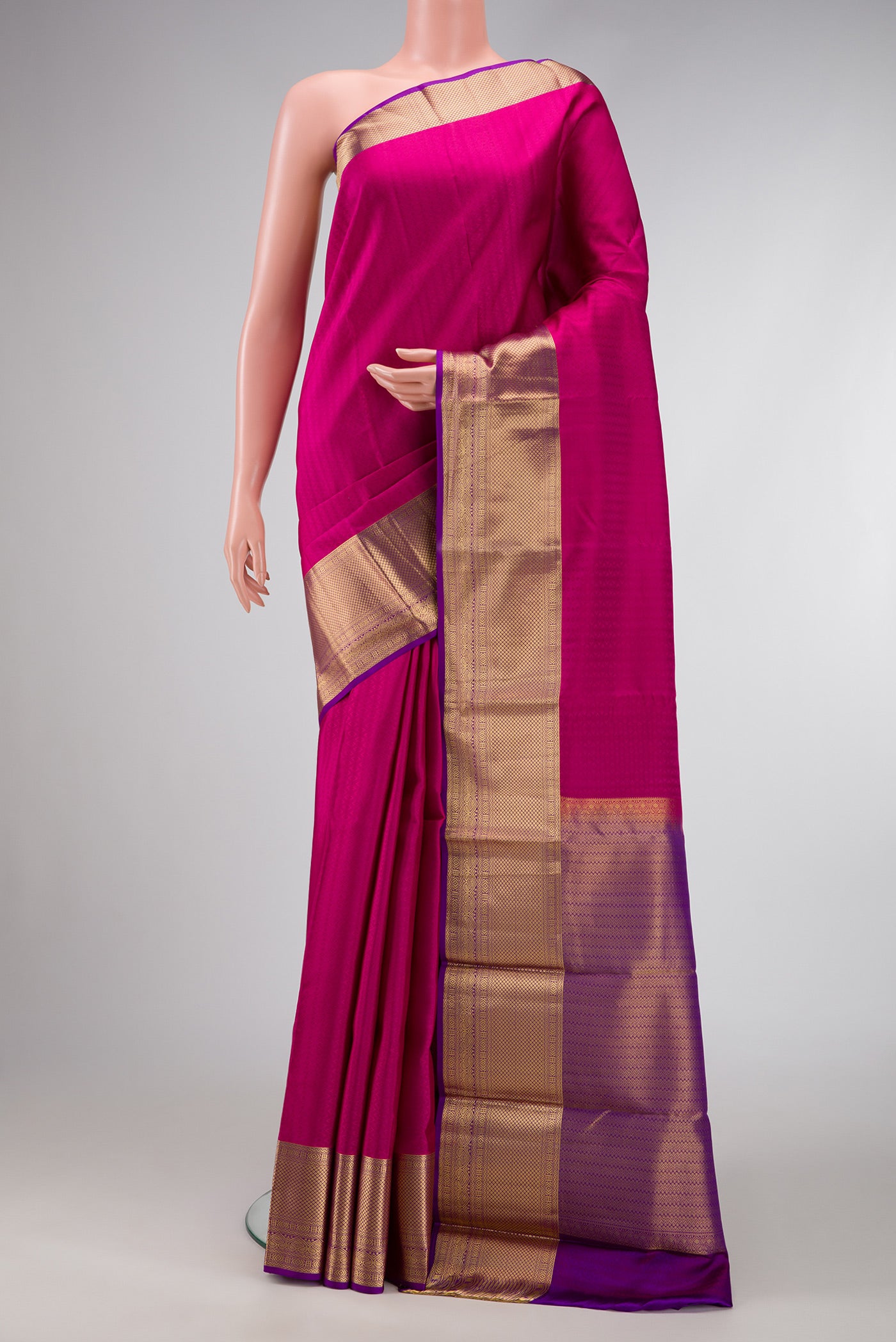 Pink Dual Tone Kanjivaram Silk Saree with Jacquard design on the body and Zari Border.  displayed on a mannequin